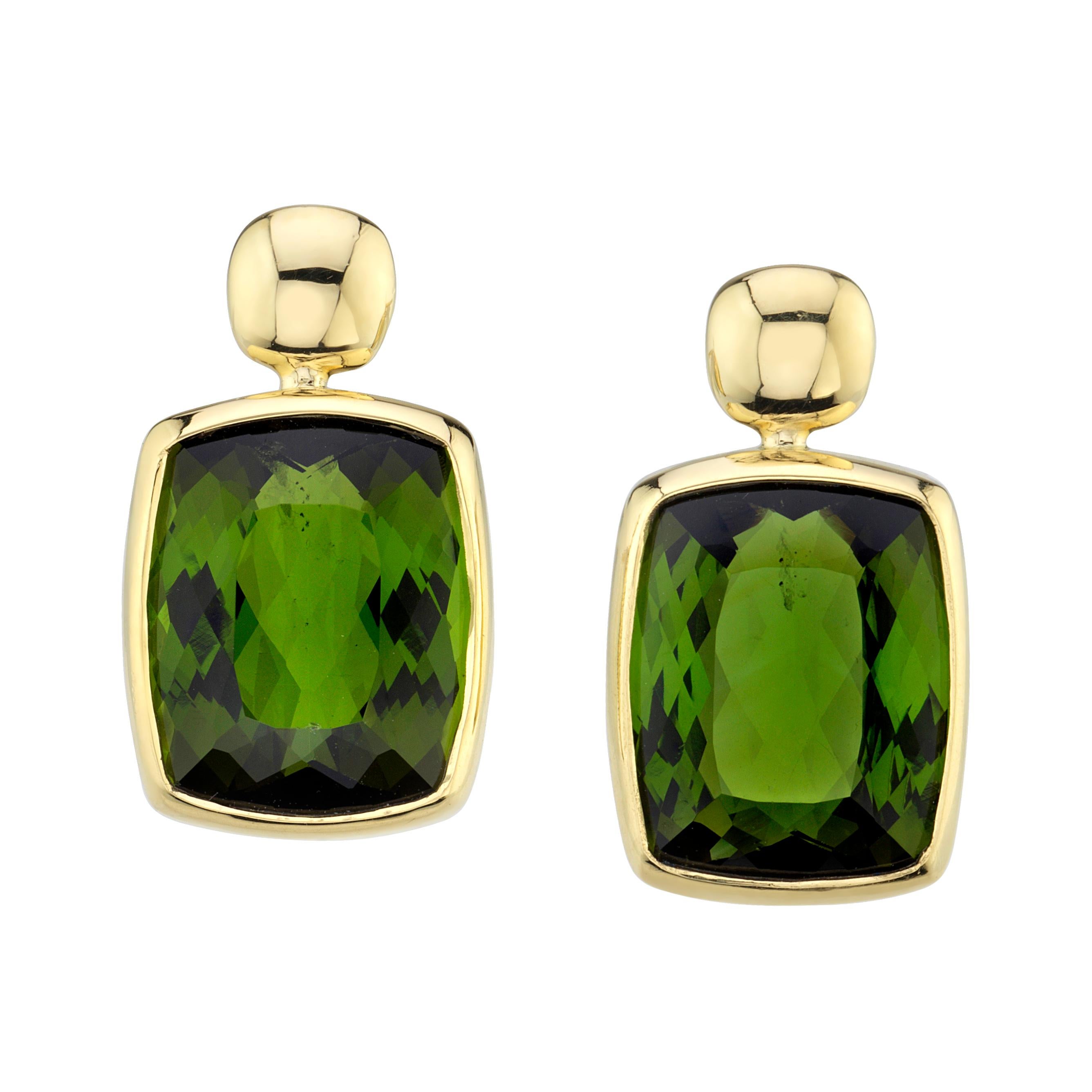 These rich green, cushion-cut tourmaline earrings will add an eye-catching pop of sophisticated color to any outfit! Set in custom-made 18k yellow gold bezels that hang just below shiny gold  posts, these gems are beautifully matched, giving off