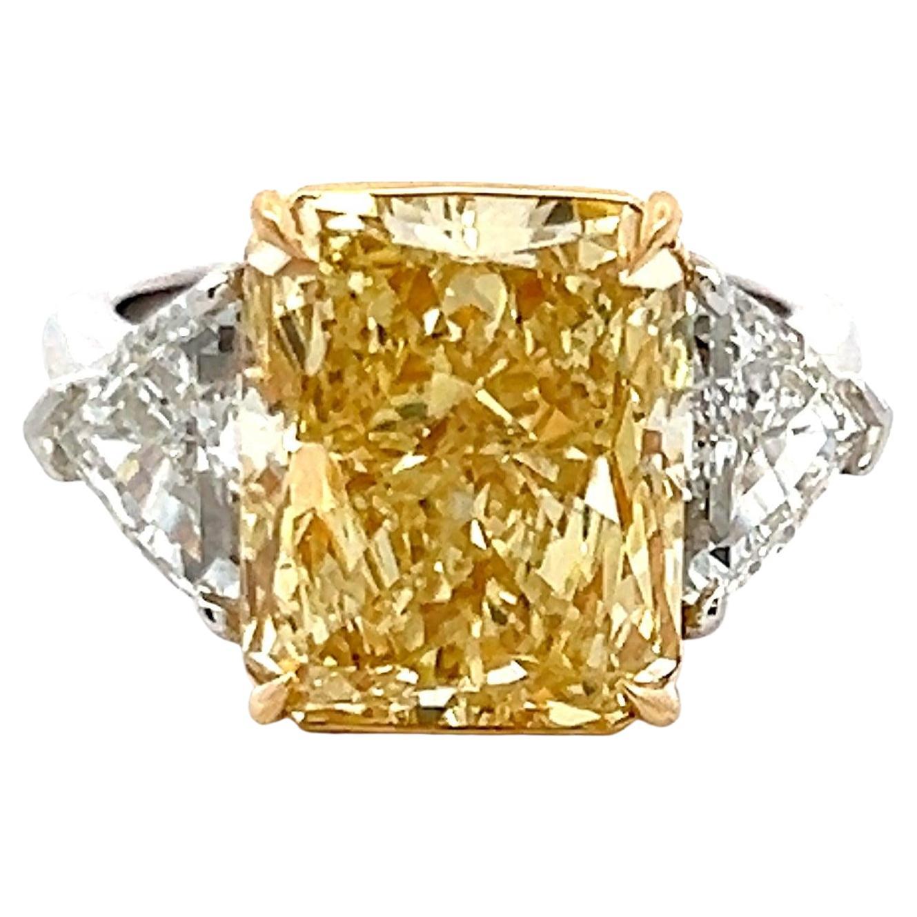 9.35 Carat Radiant Fancy Yellow and Shield Diamond Platinum Three-Stone Ring For Sale