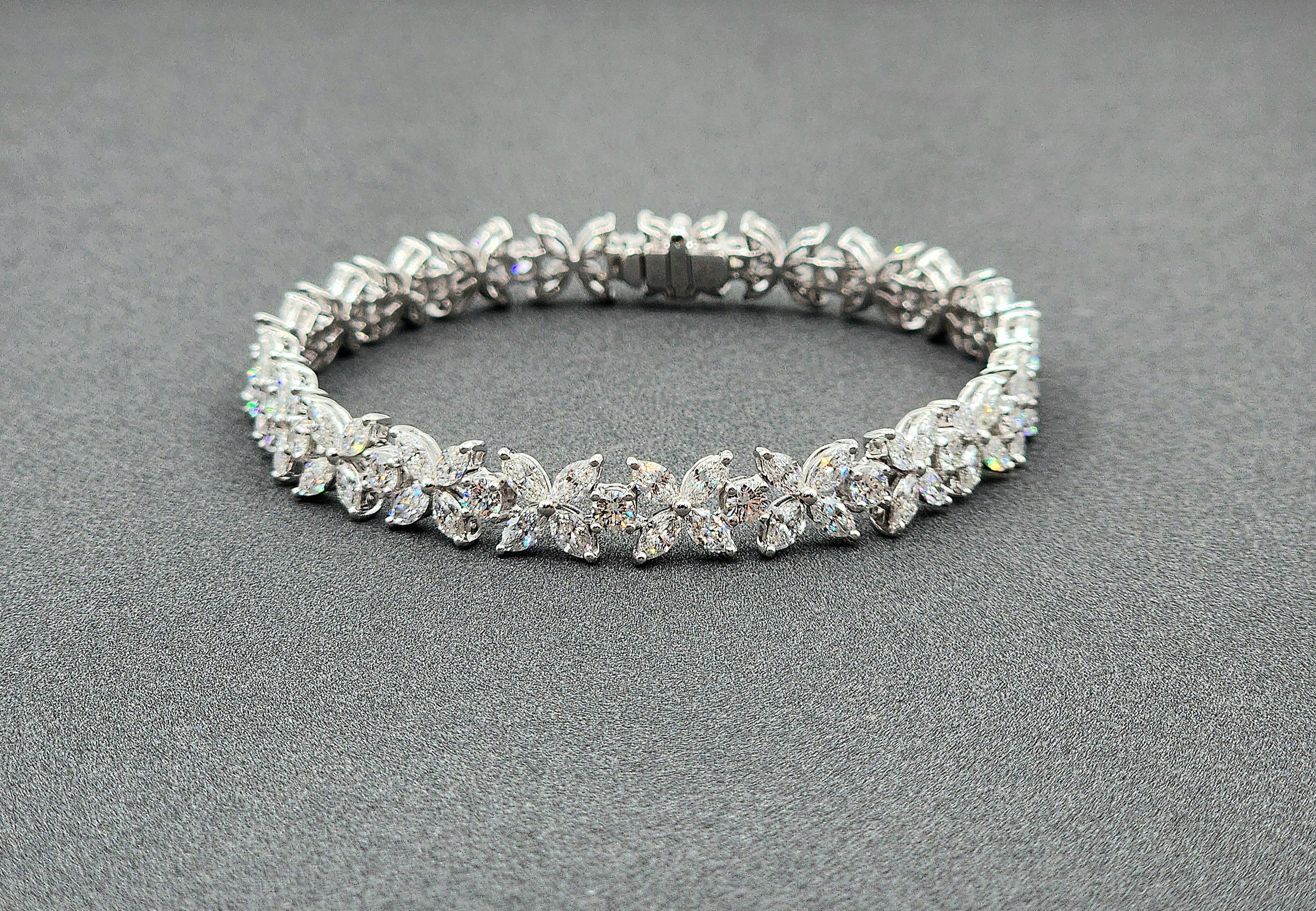 Ce magnifique bracelet de tennis en diamant marquis et rond comporte 105 diamants. Les diamants sont de couleur E/F et de pureté VS. Un superbe bracelet pour orner la garde-robe de chacun.