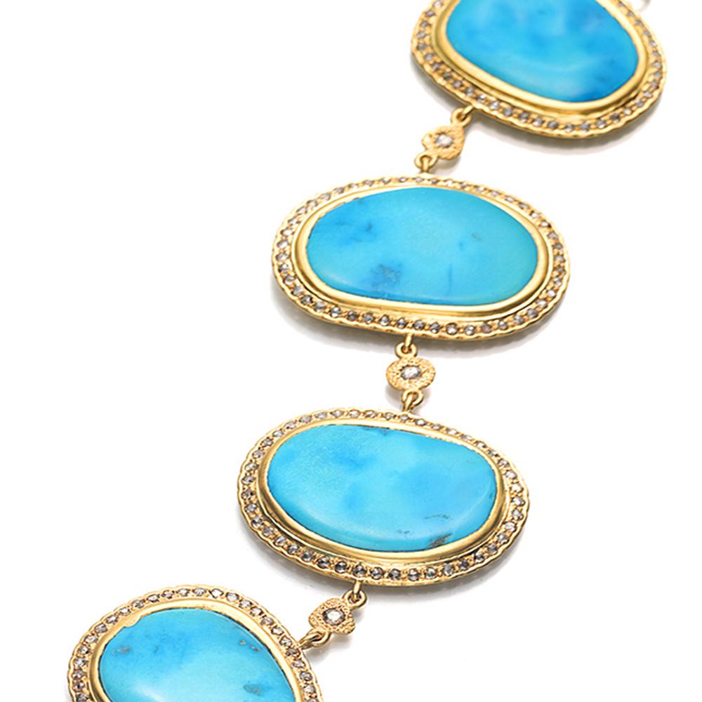Carved Turquoise Bracelet set in 20 Karat Yellow Gold with 92.65-carat Turquoise and 4.35-carat Rose-Cut Diamonds. It comes with a beautiful clasp design in 20 Karat Yellow Gold. This bracelet is part of our Affinity Collection which is inspired by