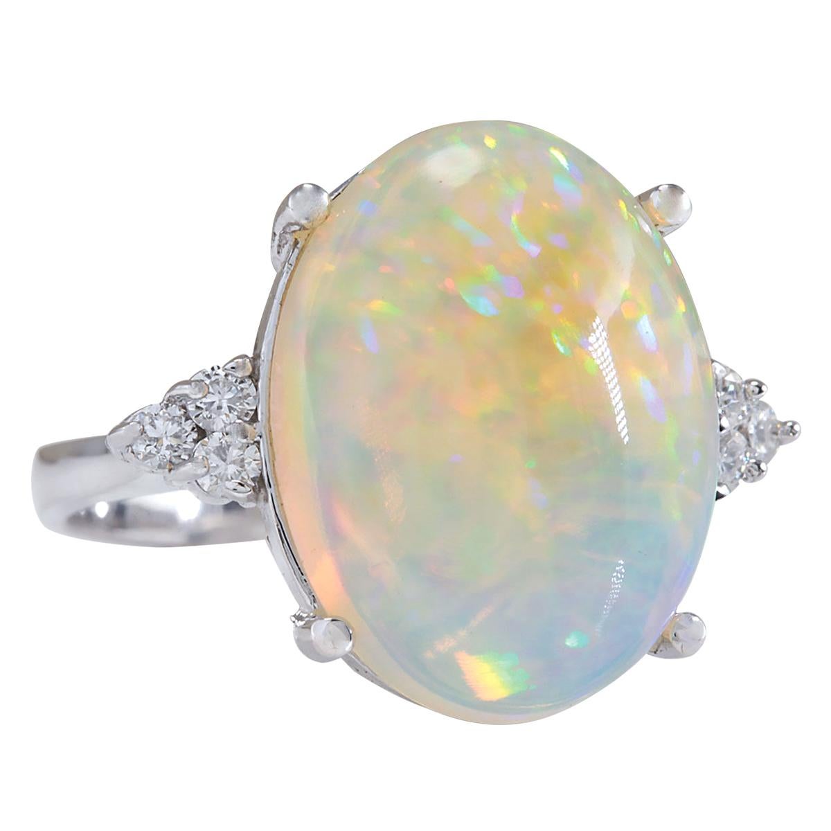 9.37 Carat Natural Opal 14 Karat White Gold Diamond Ring
Stamped: 14K White Gold
Total Ring Weight: 7.8 Grams
Total Natural Opal Weight is 9.02 Carat (Measures: 18.00x13.00 mm)
Color: Multicolor
Total Natural Diamond Weight is 0.35 Carat
Color: F-G,