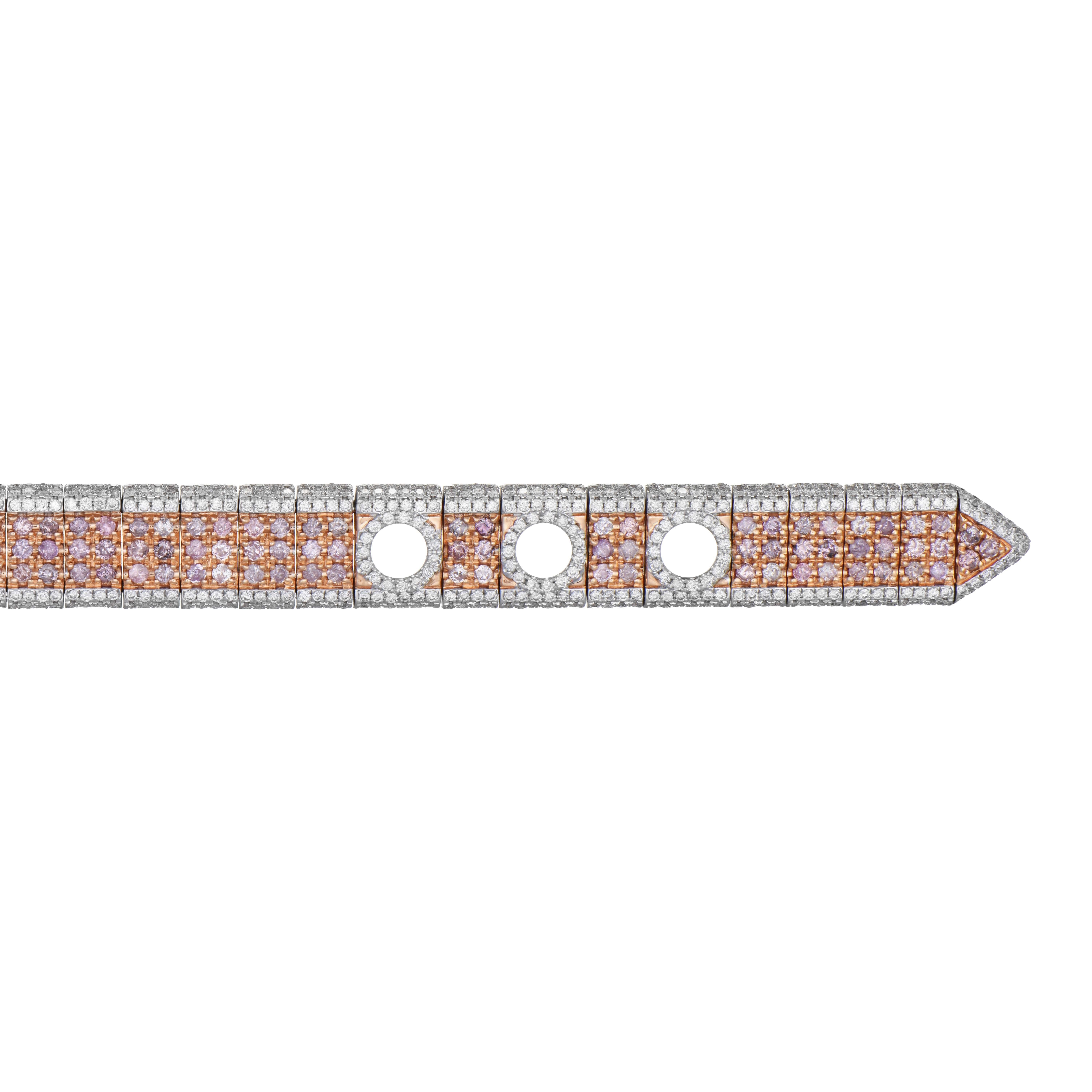 This magnificent bracelet mimics the design of a belt, making it a true masterpiece. It features three rows of pink diamonds, with assorted shades, set in 18K rose gold, and covered by white diamonds from above and below. The bracelet as a whole is