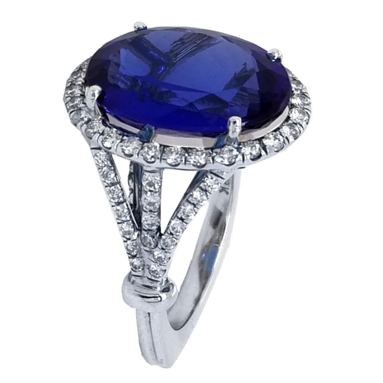 Contemporary 9.38 Carat Oval Tanzanite Split Shank Pave Set Engagement Ring with Halo For Sale