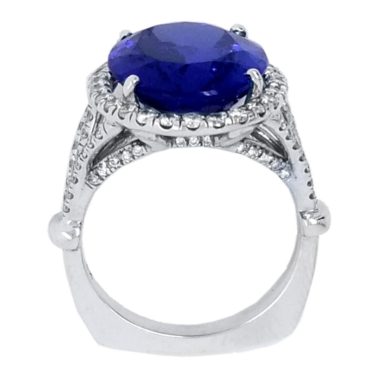 Oval Cut 9.38 Carat Oval Tanzanite Split Shank Pave Set Engagement Ring with Halo For Sale