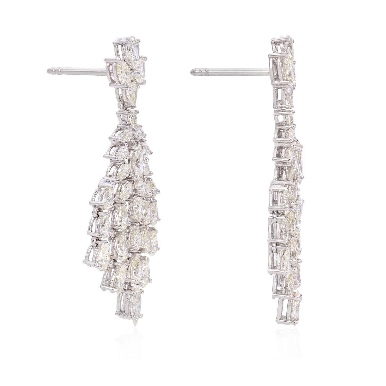 Introducing our stunning 9.39 Carat Pear and Marquise Diamond Earrings, a testament to timeless elegance and sophisticated craftsmanship. These exquisite earrings combine the unique allure of pear and marquise-cut diamonds, set in luxurious 18K