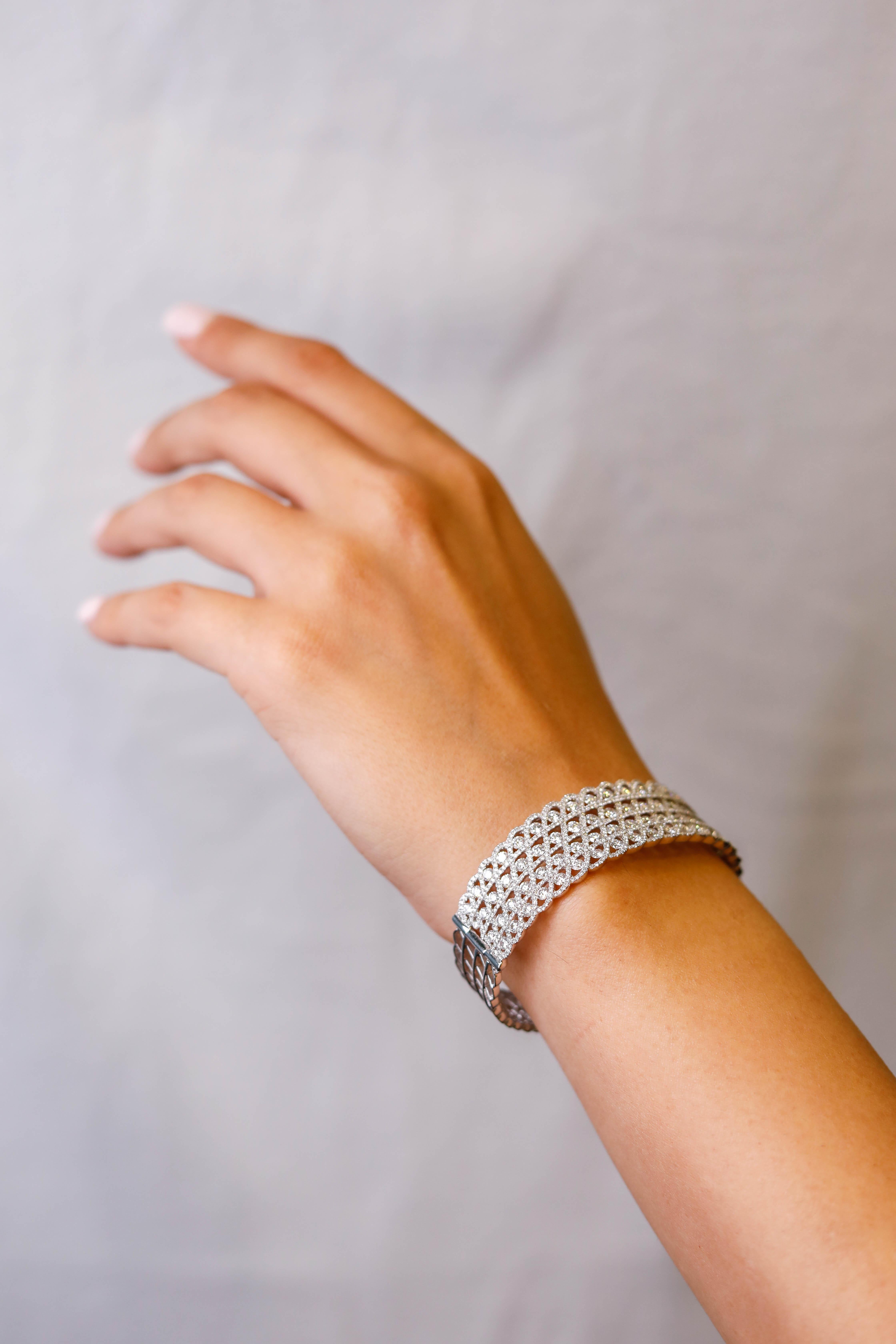 9.39 Carat White Diamond 18 Karat White Gold Cuff Bracelet Fine Jewelry

Charming Diamond Cuff Bracelet featuring the finest round gleaming diamonds, interlinked throughout the intricate design. This fine creation, polished to a brilliant shine,