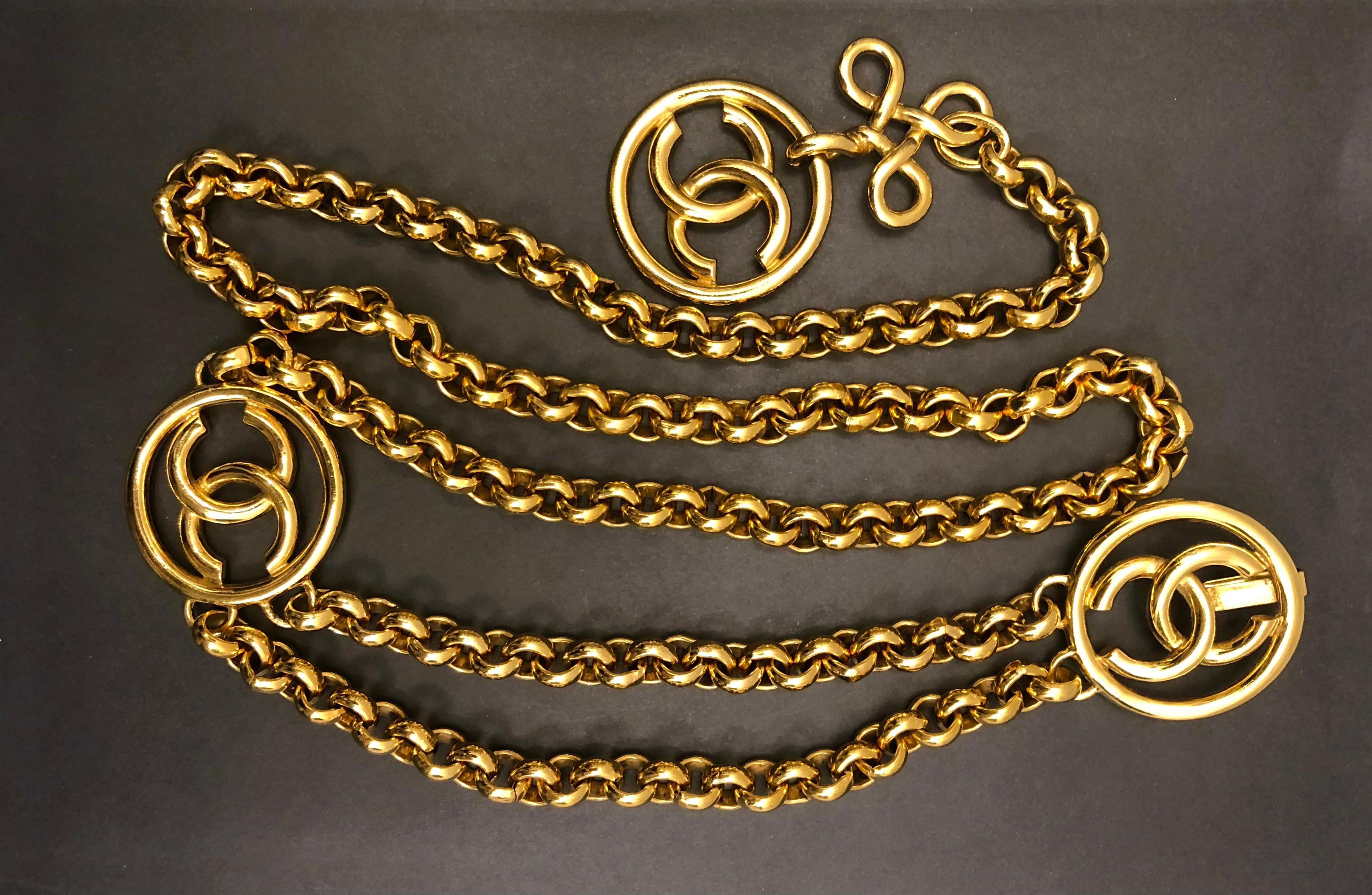 This vintage CHANEL chain belt is crafted of sturdy gold toned chains featuring a massive CC clover charm. Adjustable hook fastening. Chain measures approximately 40 inches (101.6 cm) Wearable length up to 37 inches (94 cm) Clover charm 3 inches