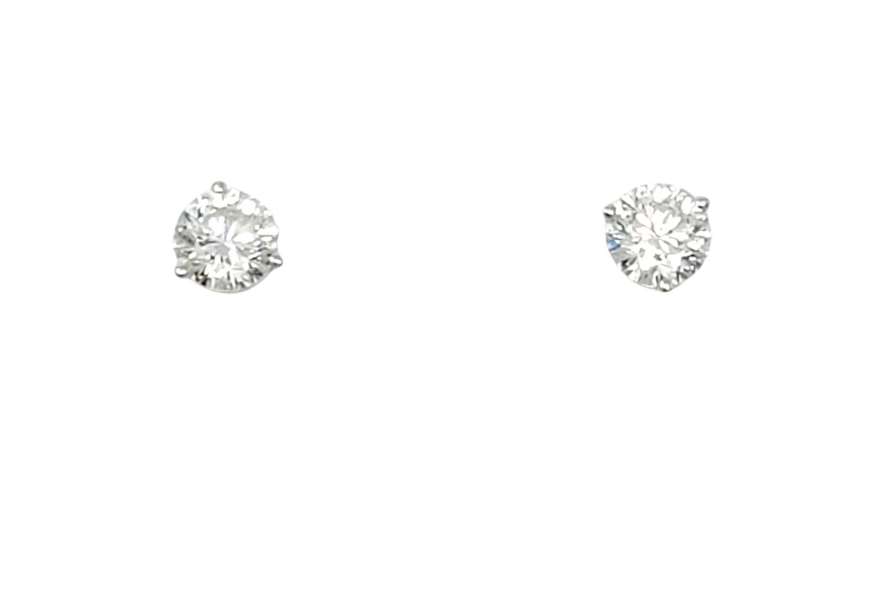 Utterly timeless diamond solitaire stud earrings. These gorgeous round diamond and white gold pierced ear studs are the epitome of minimalist elegance. They give just the right hint of sparkle for everyday wear and the classic design ensures they