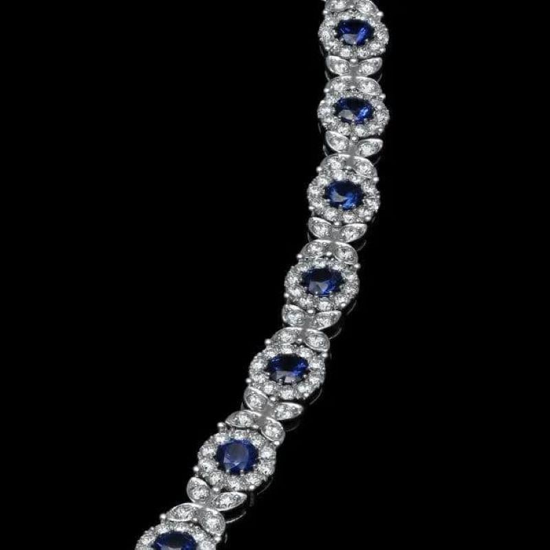 9.40 Natural Blue Sapphire and Diamond 14K Solid White Gold Bracelet

Total Natural Sapphire Weight is: Approx. 5.60 carats 

Sapphires Measure: Approx. 4mm

Sapphire Treatment: Diffusion

Total Natural Round Diamonds Weight: Approx. 3.80 Carats