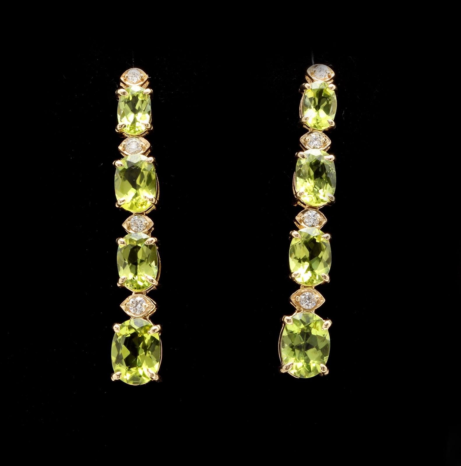 9.40 Carats Natural Peridot and Diamond 14K Solid Yellow Gold Earrings

Amazing looking piece!

Total Natural Round Cut White Diamonds Weight: Approx. 0.40 Carats (color G-H / Clarity SI1-SI2)

Total Natural Oval Cut Peridots Weight: 9.00