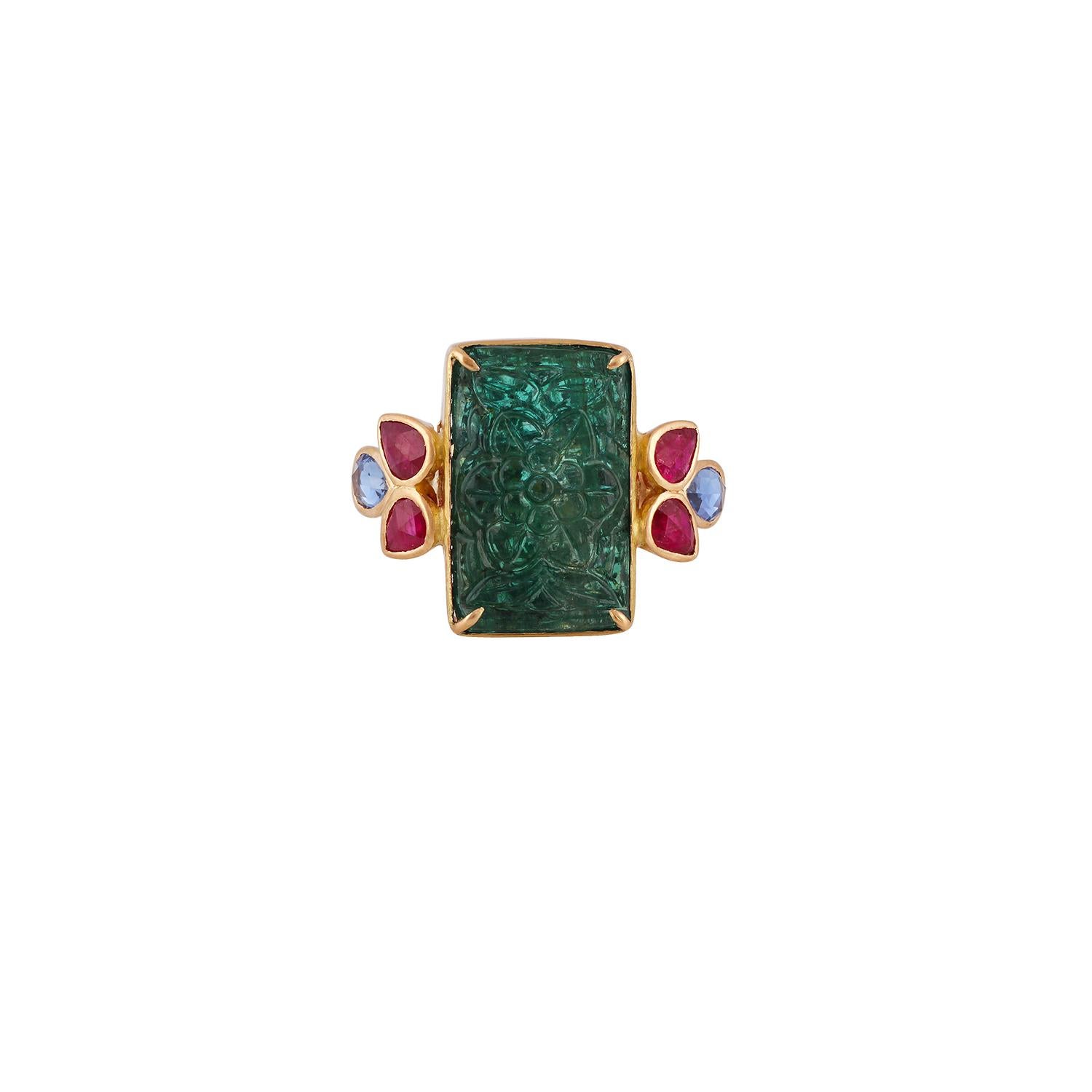 This is an elegant Carved Zambian Emerald, Sapphire & Ruby Ring with 1 piece of Carved Zambian emerald weight 9.41 carat which is surrounded by Sapphire  weight 0.71 carat & Ruby  weight 0.92 carat  this entire ring studded in 18k Yellow gold 

Ring
