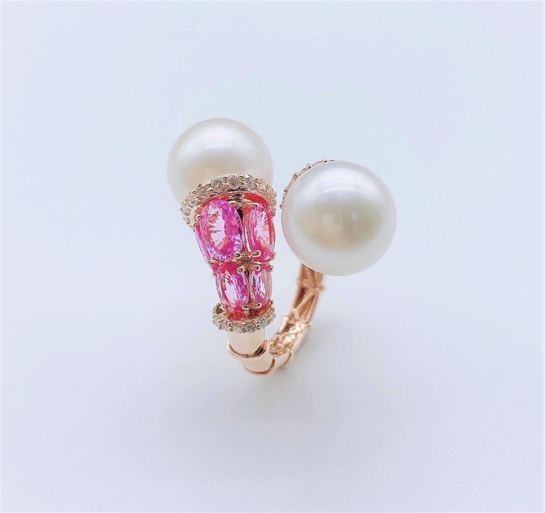 The Following Item we are offering is this Extremely Rare Beautiful 18KT Gold White Fine South Sea Pearl Crossover Ring comprised of Rare Fine Fancy Pink Sapphires and with Gorgeous Glittering Diamonds!!! The Diamonds, Pearls and Pink Sapphires are