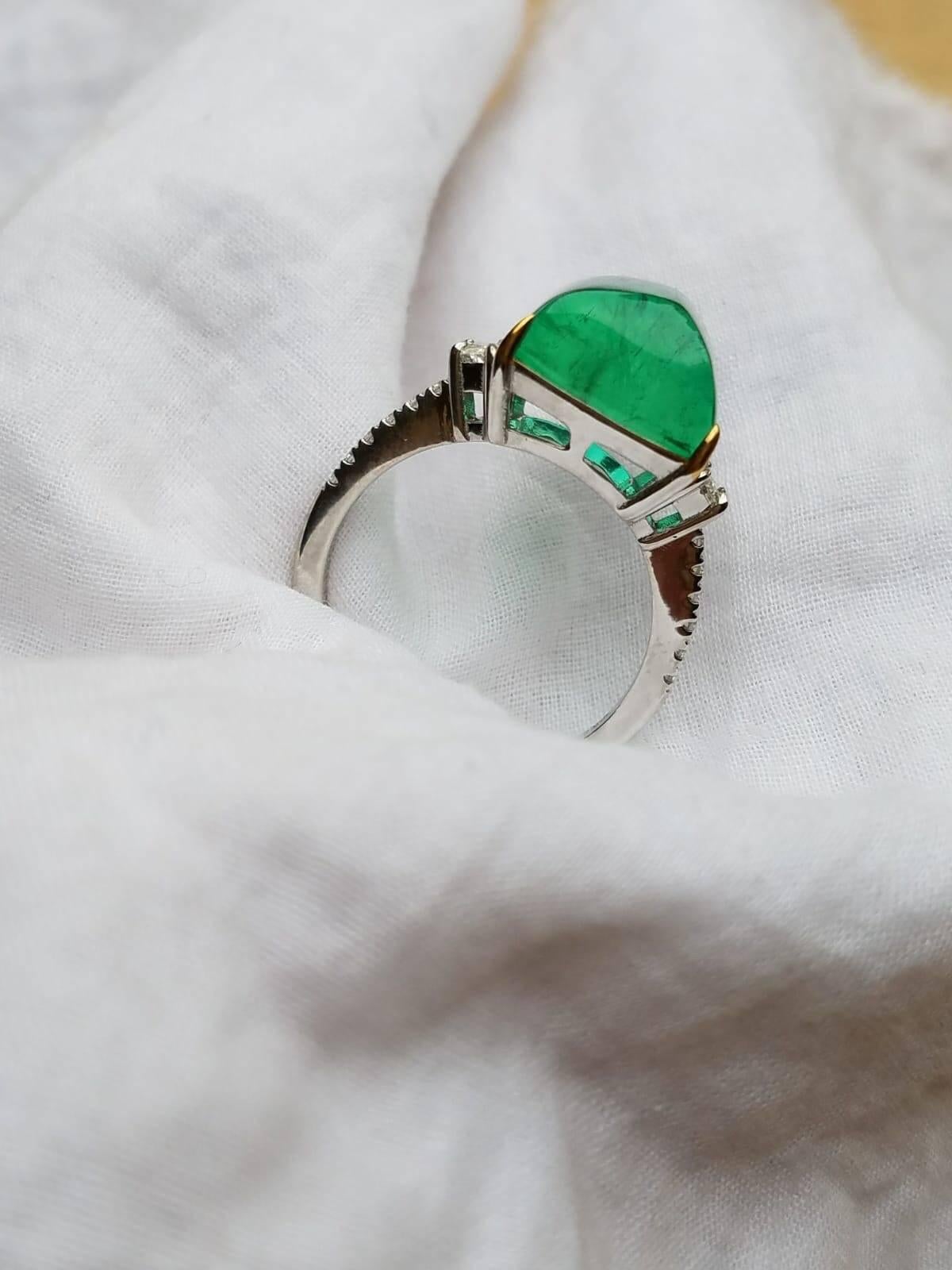 Cushion Cut 9.43 Carat Sugarloaf Shape Emerald and Diamond Three-Stone Ring