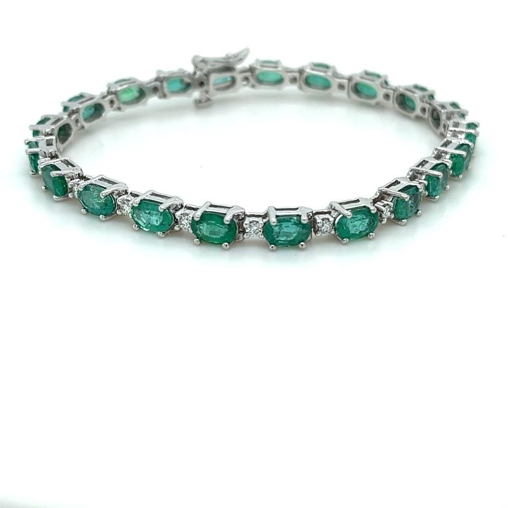Oval Cut 9.44 Carat Emerald & Diamond Bracelet in 14 Karat White Gold For Sale