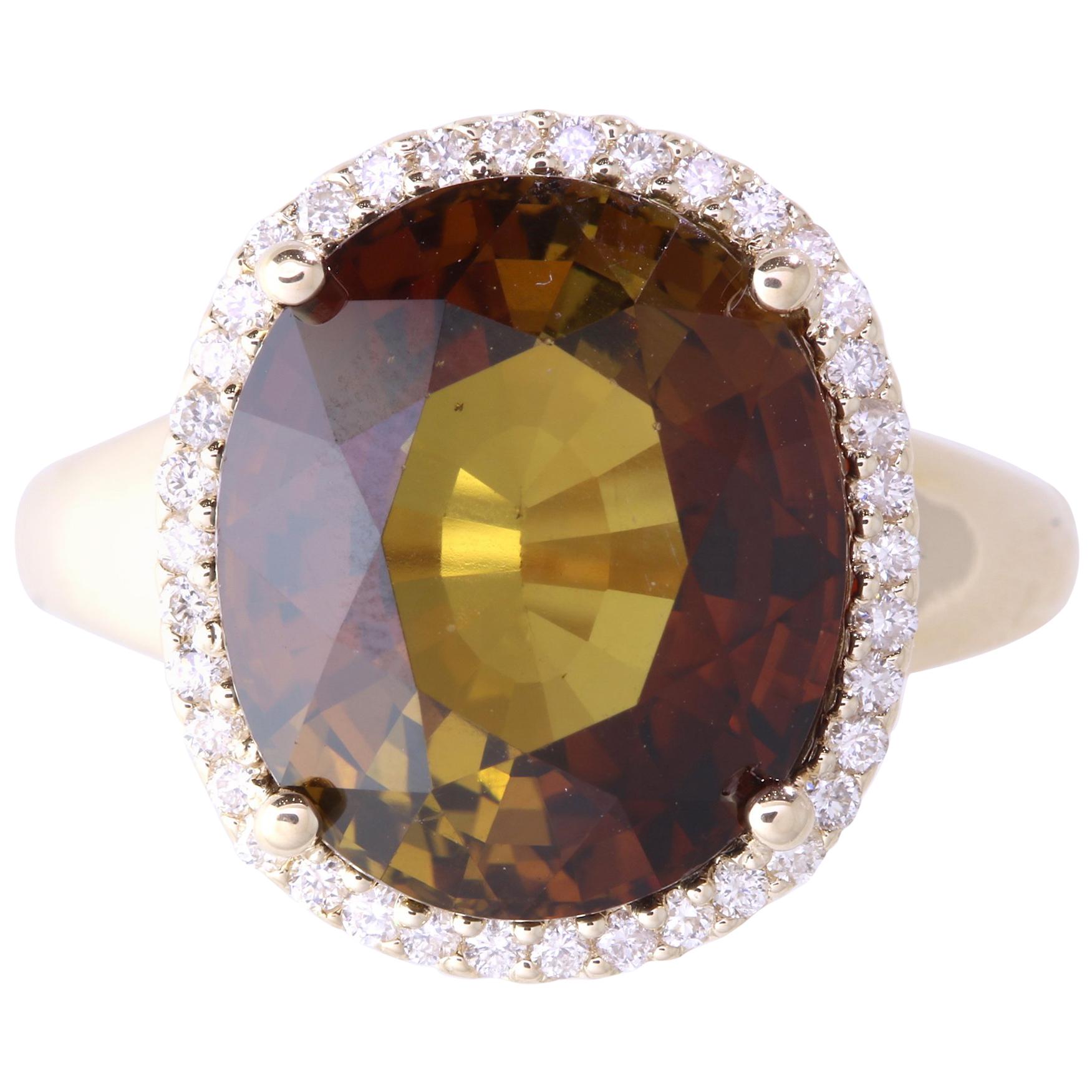 Material: 14k Yellow Gold 
Center Stone Details: 9.44 Carat Oval Tourmaline 
Mounting Diamond Details: 38 Brilliant Round White Diamonds Approximately 0.28 Carats - Clarity: SI / Color: H-I
Ring Size: Size 6.75. Alberto offers complimentary sizing
