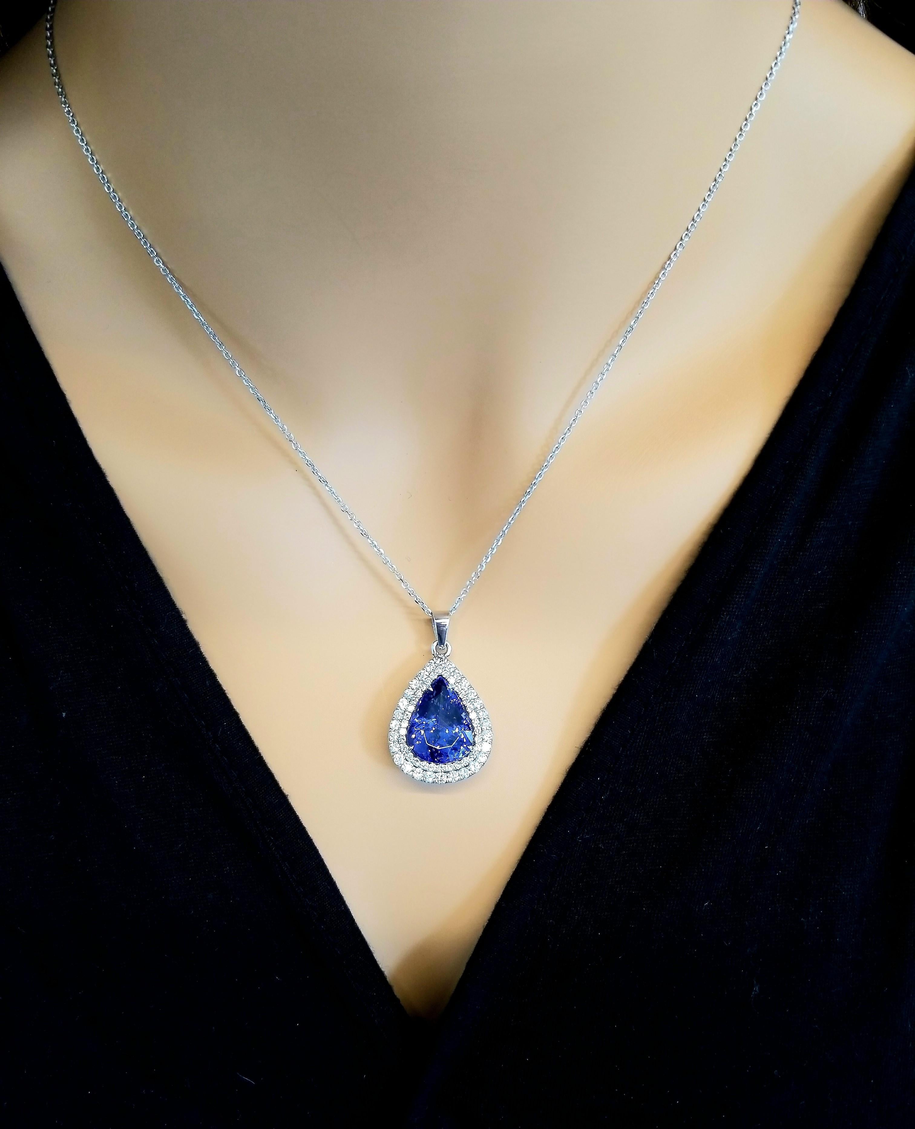 This piece was designed around the 9.45 carat pear-shaped tanzanite. The gem source is near the foothills of Mt. Kilimanjaro in Tanzania. The intense blue-violet color resembles fine blue sapphire. The saturation is what you want; its transparency