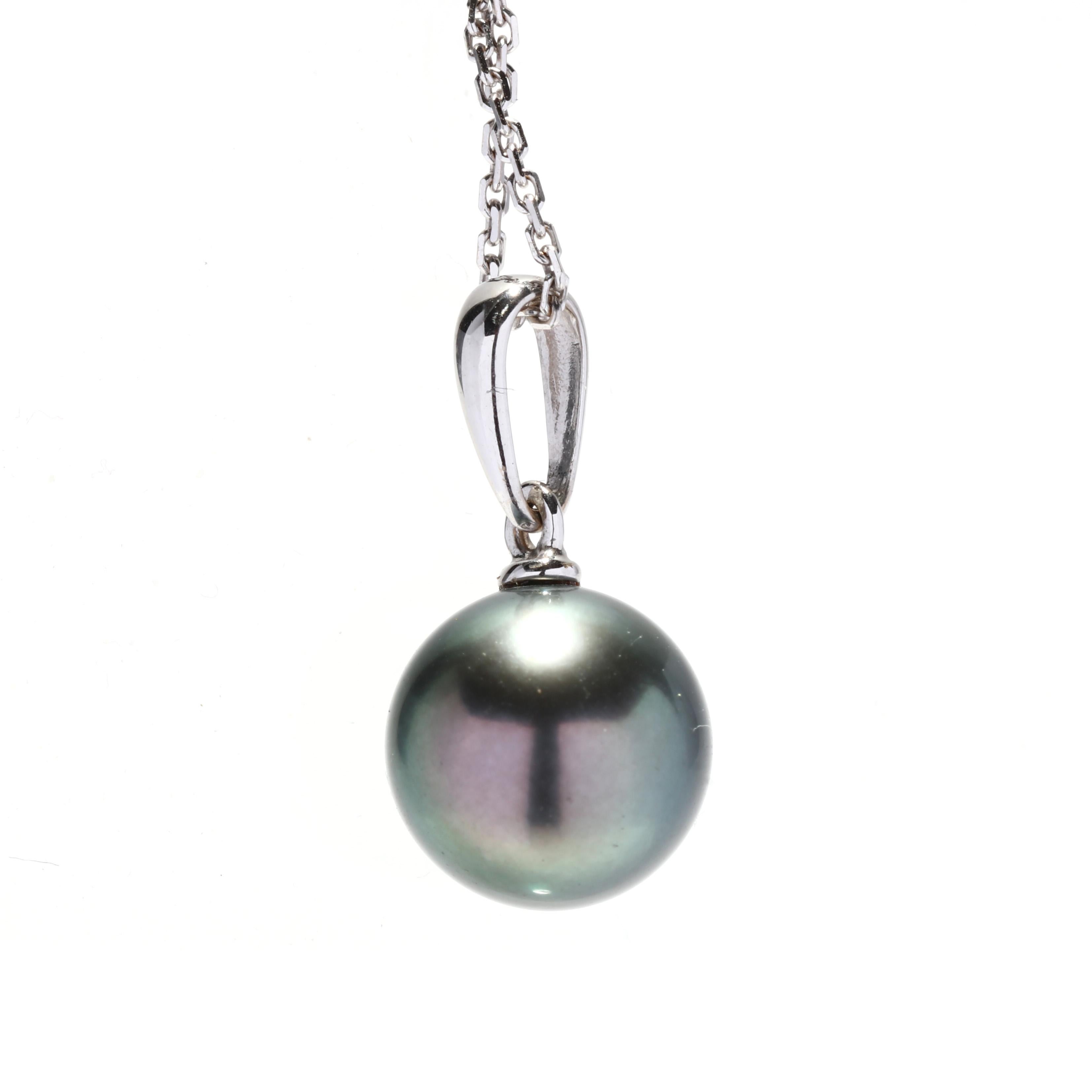 A 14 karat white gold Tahitian pearl solitaire pendant necklace. This simple necklace features a round bead Tahitian pearl suspended from a thin tapered bail and a thin cable chain with a spring ring clasp.

Stones:
- Tahitian pearl, 1 stone
- round