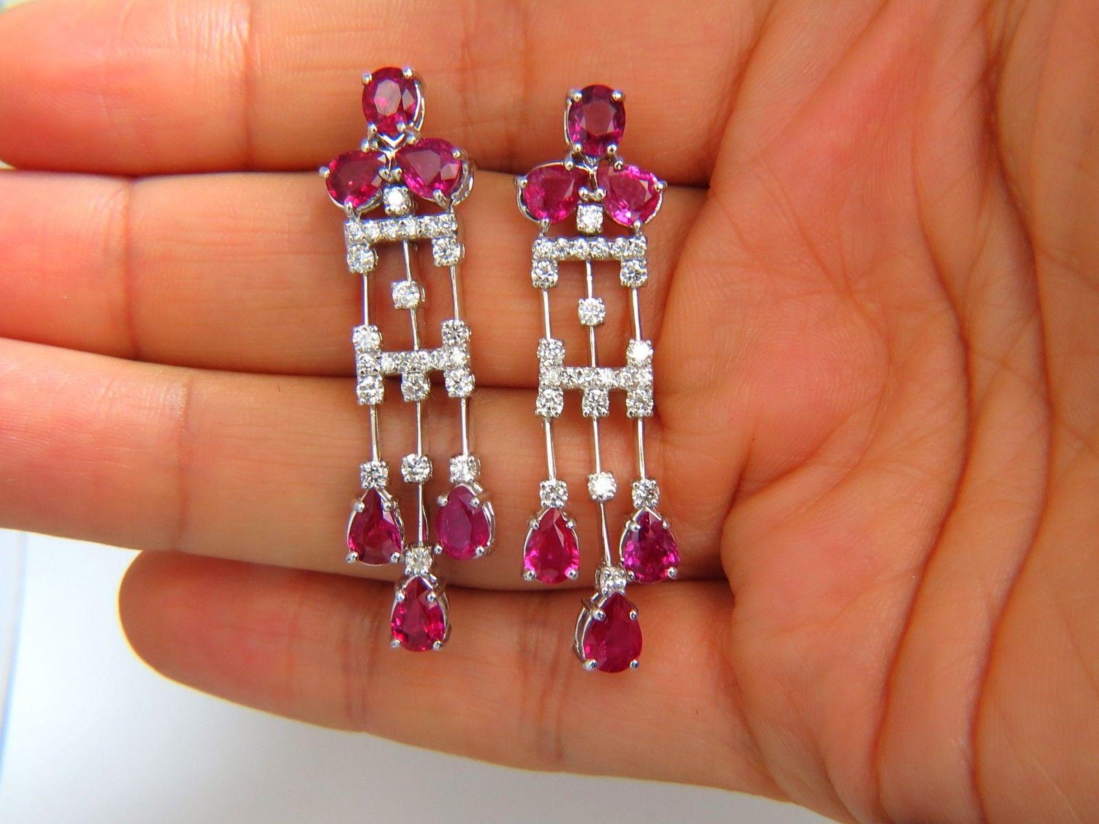 The No Heat Rubies Dangle

Regency Deco Revival.



8.56ct. Natural Unheated Pear shaped Red Rubies.

Clean Clarity & transparent

Vivid red.



.90ct. Round Brilliant full cut diamonds.

F/G-color Vs-2 clarity

Measures:

1.95 Inch long X .54 inch