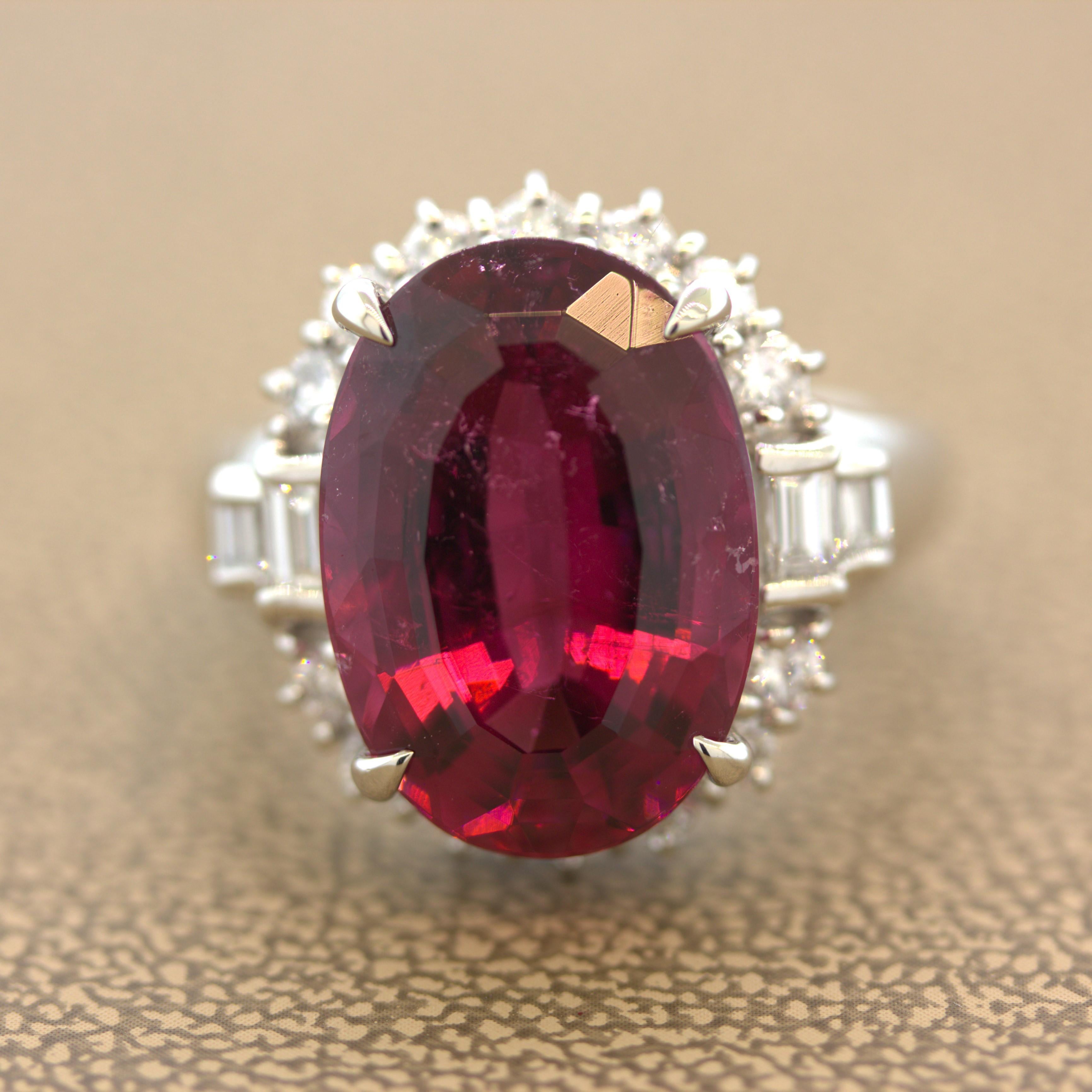 A chic and classy ring featuring a vibrant rubellite tourmaline weighing 9.46 carats. It has a lovely oval shape along with a rich and brilliant red color that will make you smile. It is complemented by 1.00 carat of round brilliant and baguette-cut