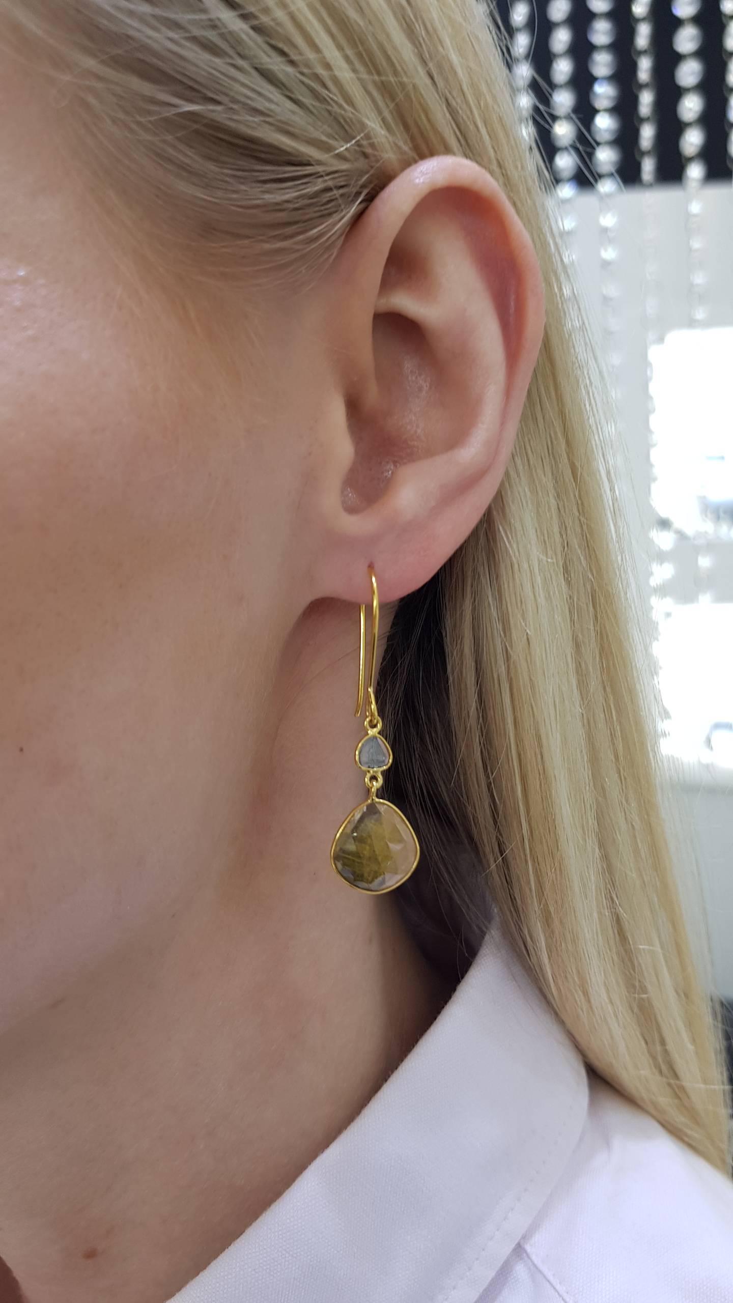 These Gorgeous 9.25 Carat Rose Cut Yellow Sapphire Earrings from the Artisan Collection feature 0.22 Carat in two Diamond slices set in 18 Karat Yellow Gold. Each piece is hand made with a unique shaped precious stones. These elegant and lightweight