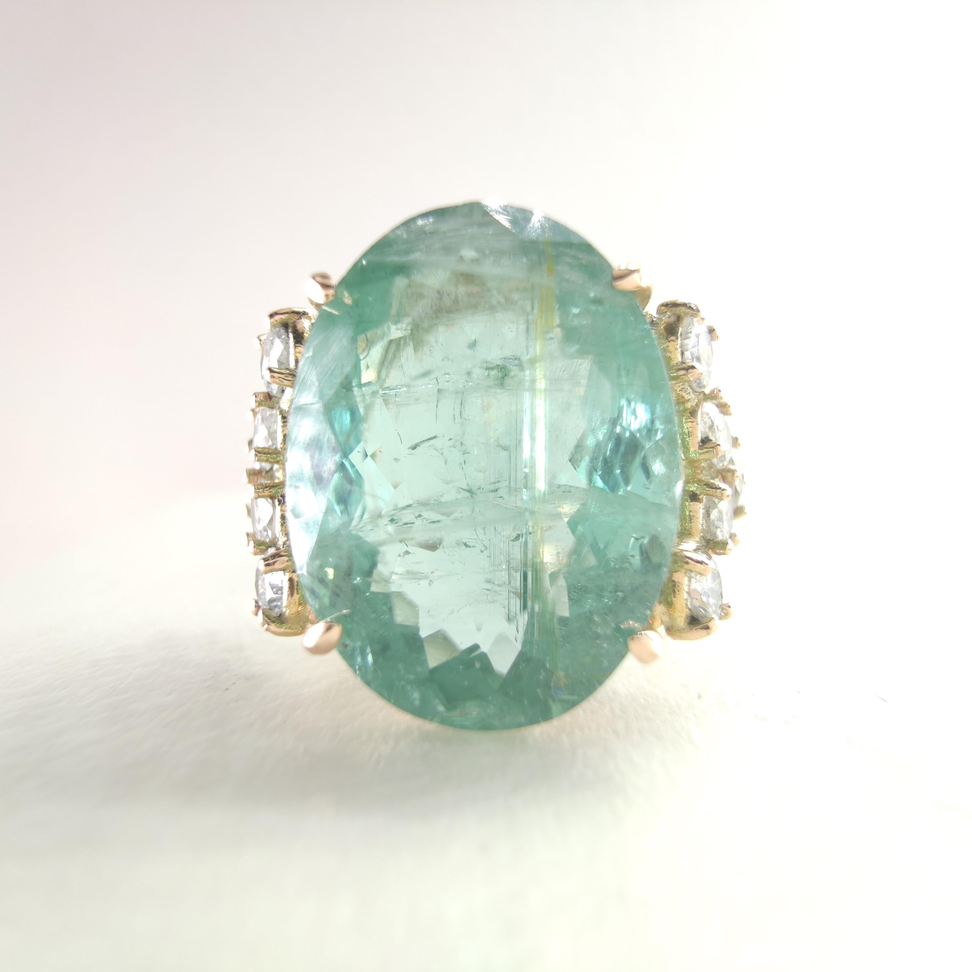 Ring Size: US 7.25 / 
EU 15 (Resizable at no additional cost)

This one-of-a-kind cocktail ring for women is a bold and masterful celebration of color and light. Handcrafted in 14K gold, the centerpiece is an impressive 9.47-carat natural green