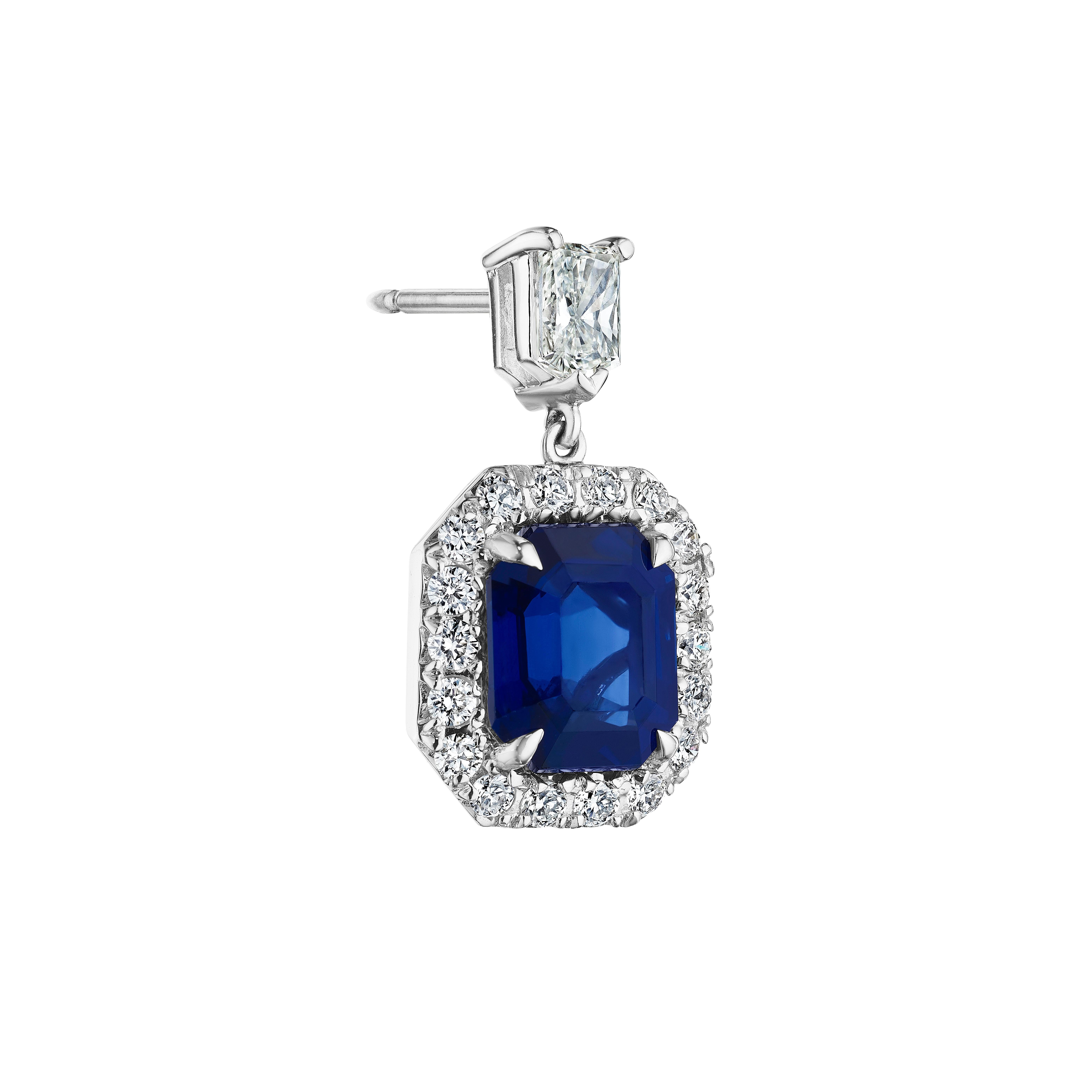 •	9.48 Carats
•	18KT White Gold

•	Number of Emerald Cut Sapphires: 2
•	Carat Weight: 7.84ctw

•	Number of Bullet Cut Diamonds: 2
•	Carat Weight: 0.84ctw

•	Number of Round Diamonds: 36
•	Carat Weight: 0.80ctw

•	A beautiful deep blue emerald cut