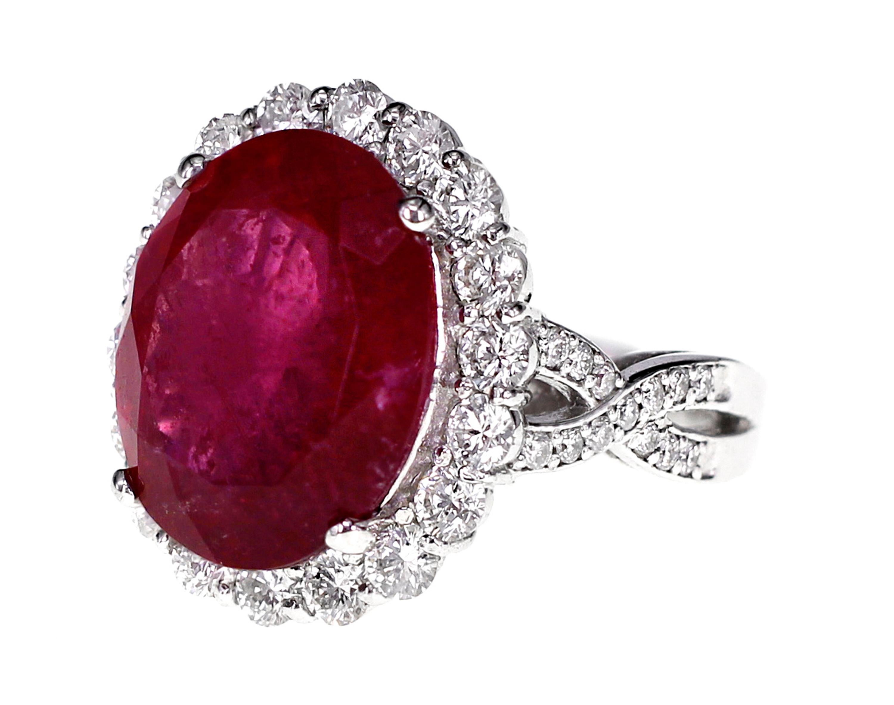 A 9.49 carat vivid red color Brazilian Rubellite is set with 1.68 carat of F color VS clarity white brilliant round diamond.
The image of the certificate can be found alongside the images of the ring. 
Ring Size : US 6.25
Ring size can be changed as
