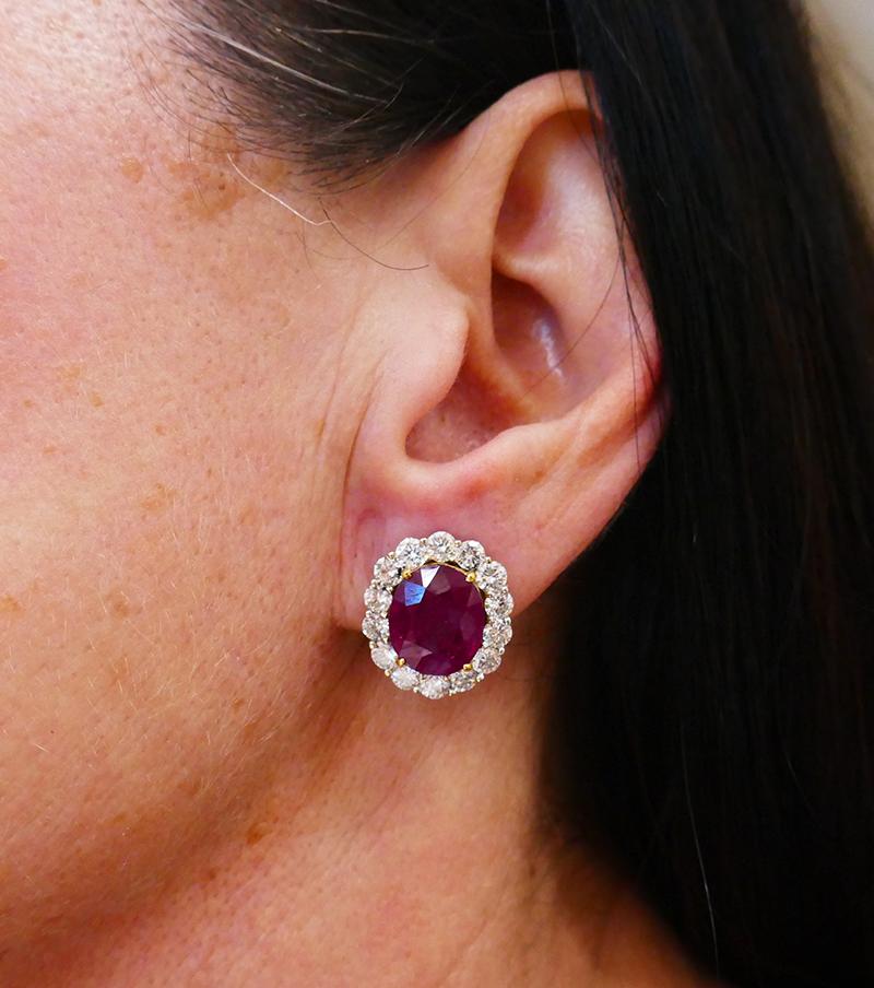 Classy earrings featuring two oval rubies - 4.89-ct and 4.60-ct. The rubies come with a GIA Ruby Origin Report stating that the rubies are not heated and are of Burmese origin. The rubies are framed with round brilliant cut diamonds - total weight