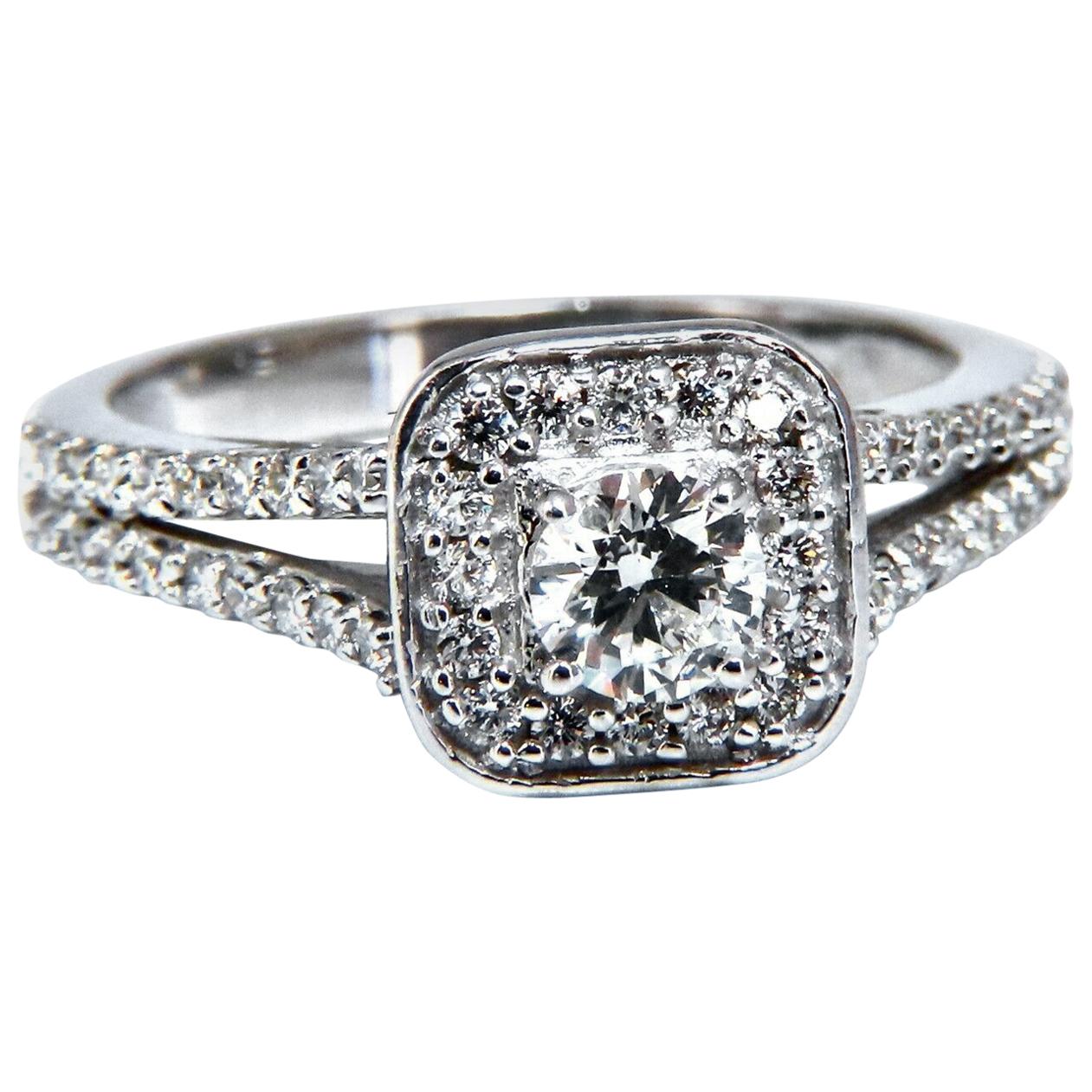 Double Shanked Diamond Mod Ring
.40ct. Natural round center diamond

H-color Si-1 clarity

.55ct side round diamonds, channel mounted.

Vs-2 clarity  G/H color.

14kt white gold.

4.3 Grams

Overall ring: 9.3mm

Depth: 9mm

Current ring size: