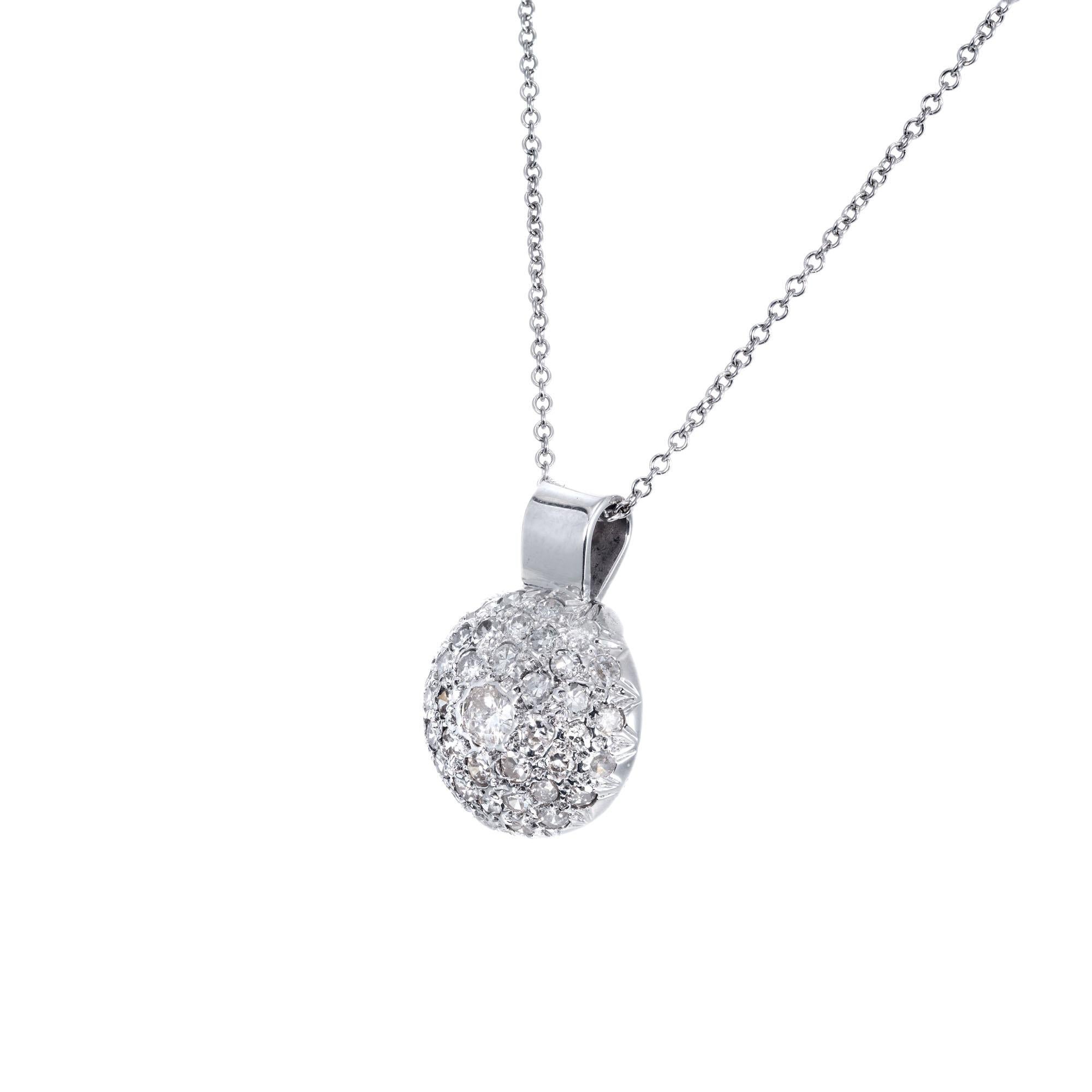 Round domed pave set diamond cluster pendant necklace in 14k white gold on a 16 inch chain.  

41 round brilliant cut diamonds I-J, SI-I approx..95ct
14k white gold 
Stamped: 14k
4.6 grams
Top to bottom: 20.5mm or 4/5 Inch
Width: 16.3mm or .5