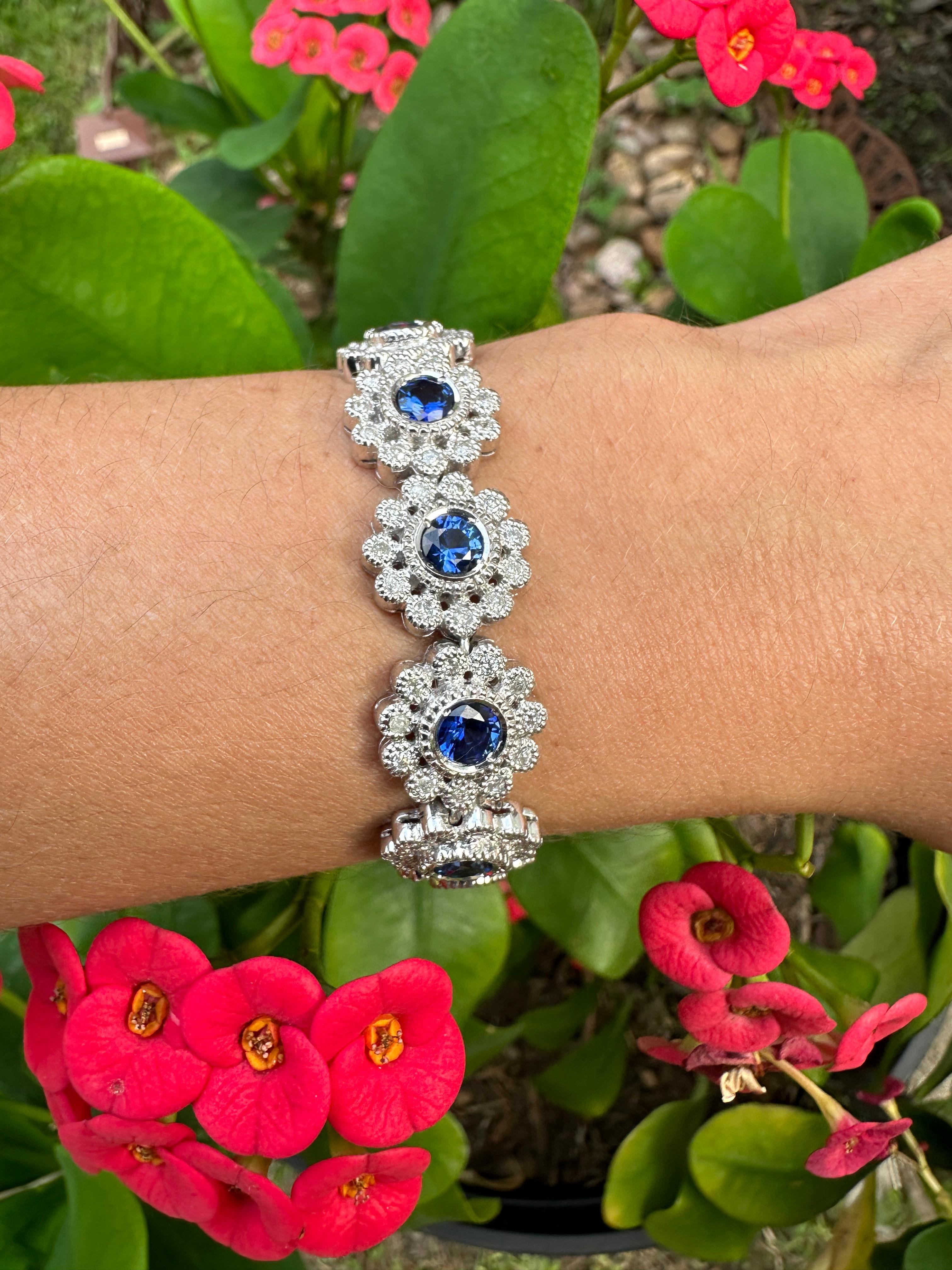 Stylish and modern with a touch of retro blue sapphire and diamond bracelet.
This remarkable piece features 13 vivid royal blue sapphires from Sri Lanka and 143 round full cut diamonds F-G in color and SI clarity.
Total weight of sapphires is