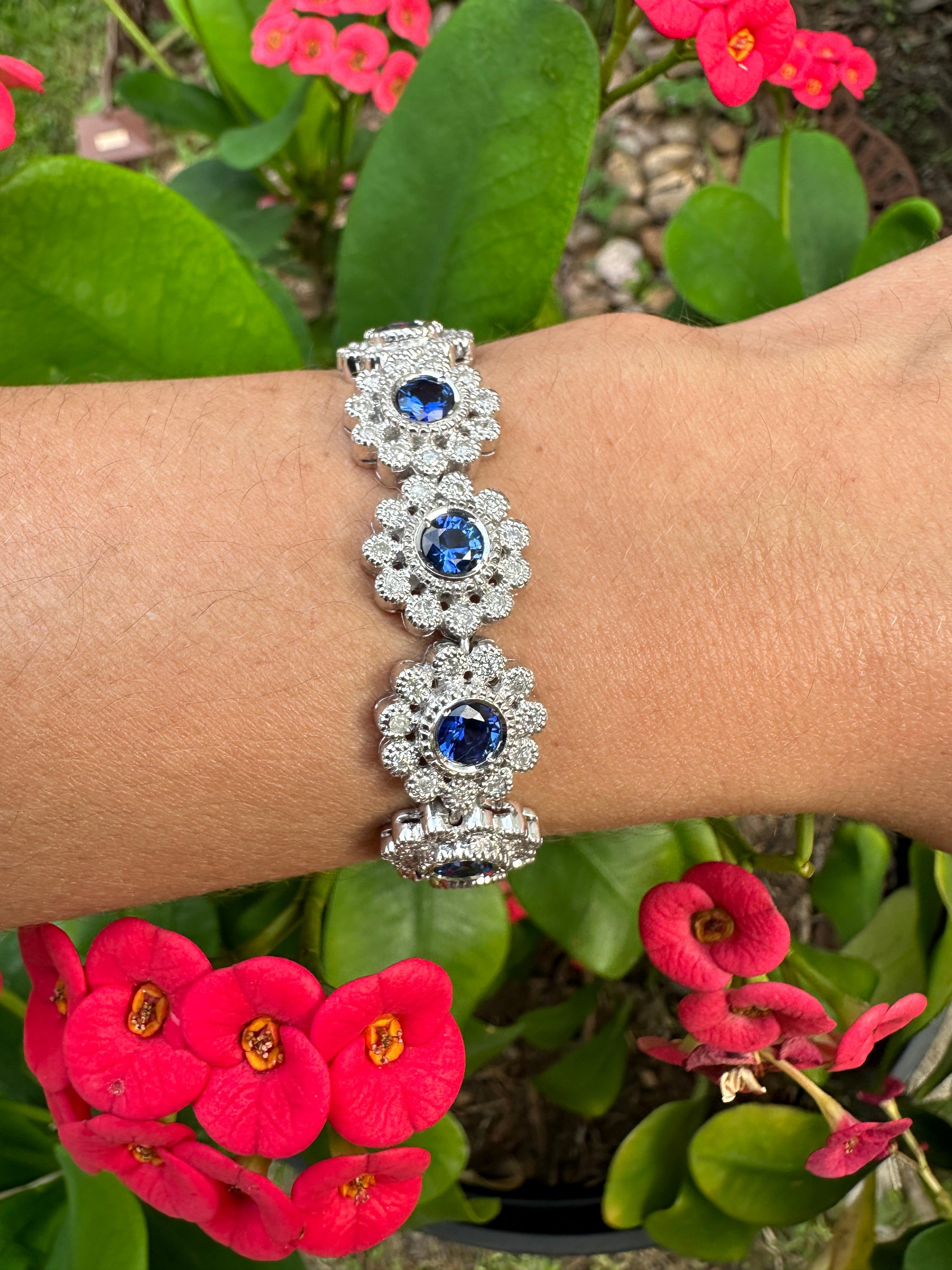 Blue Sapphire and Diamond Link Bracelet in 18k Gold  

A stylish blend of modern design with a retro touch, this stunning bracelet features 13 vivid royal blue sapphires from Sri Lanka, totaling approximately 6.5 carats. Accented by 143 round