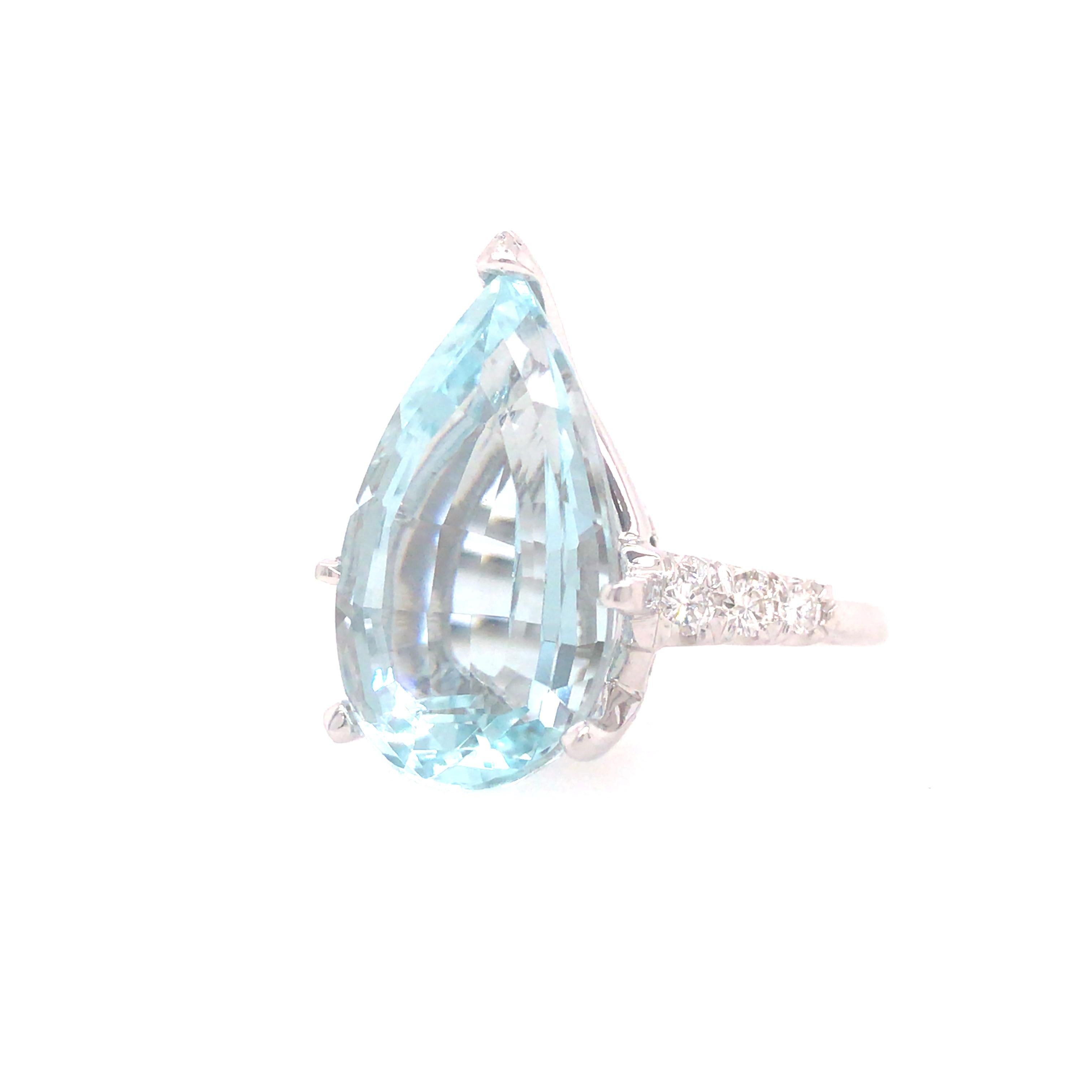 9.50 Carat Pear Shape Aqua Ring with Diamonds in 14K White Gold.  (6) Round Brilliant Cut Diamonds weighing 0.24 carat total weight, G-H in color and VS in clarity are expertly set in the Shank.  Ring size 6. 6.8 grams.