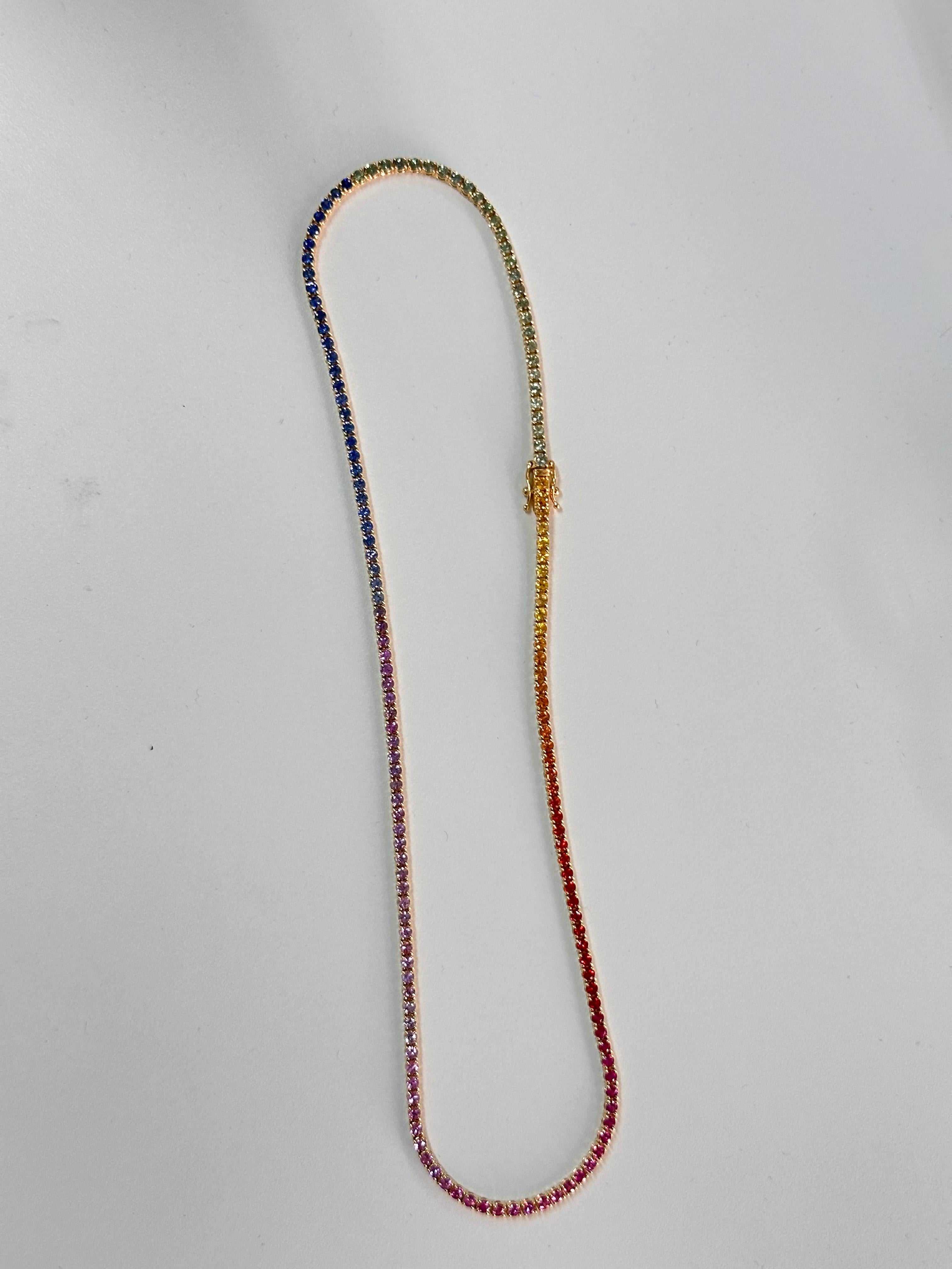 Presenting this beautiful Sapphire Studded Necklace that is made in high quality 18K Yellow Gold and is studded with a whopping 9.50 Carat multi Sapphires. All natural sapphires have been used. The bracelet is studded with different hues of
