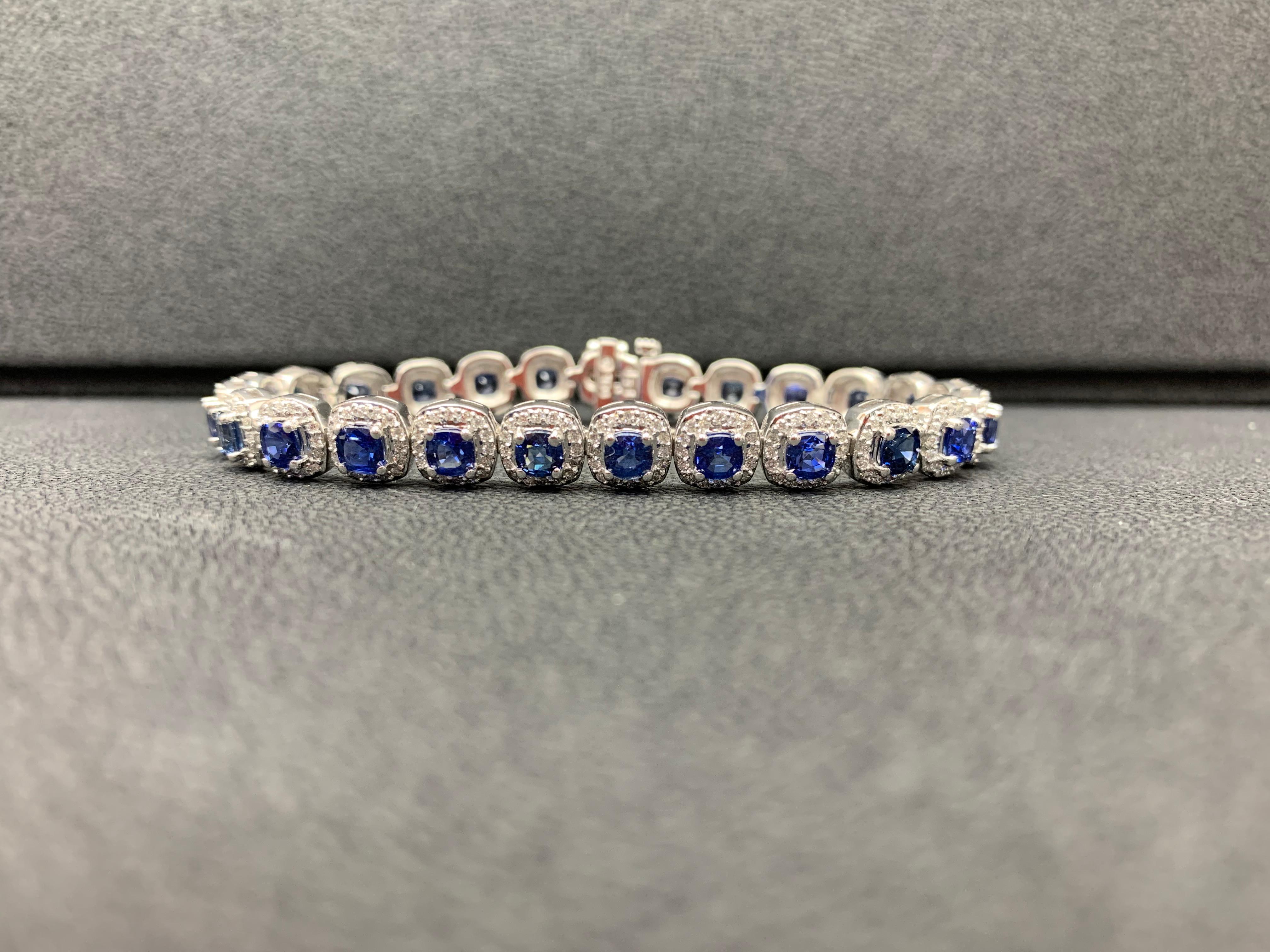 This gorgeous bracelet features 25 round brilliant blue sapphires weighing 9.50 carats total. Each stone is surrounded by a single row of small round diamonds weighing 166 carats total. Set in 14k white gold.

Style available in different price