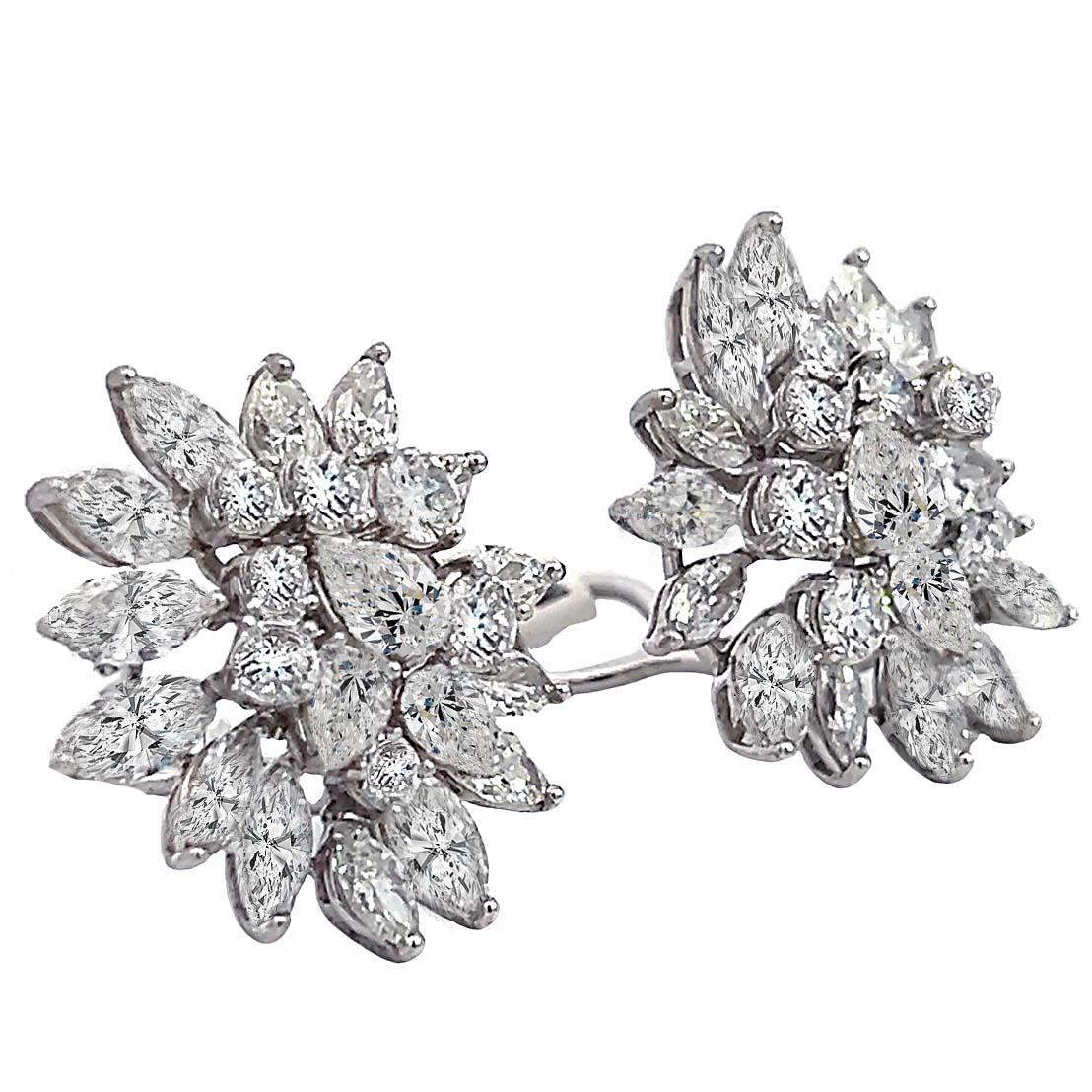 Impressive diamond earrings boast a total of 48 diamonds with an estimated weight of 9.50 - 10 carats. The diamonds come in various shapes including round, marquise, and pear shapes, adding to the allure of the design.

With a diameter of 1 inch,