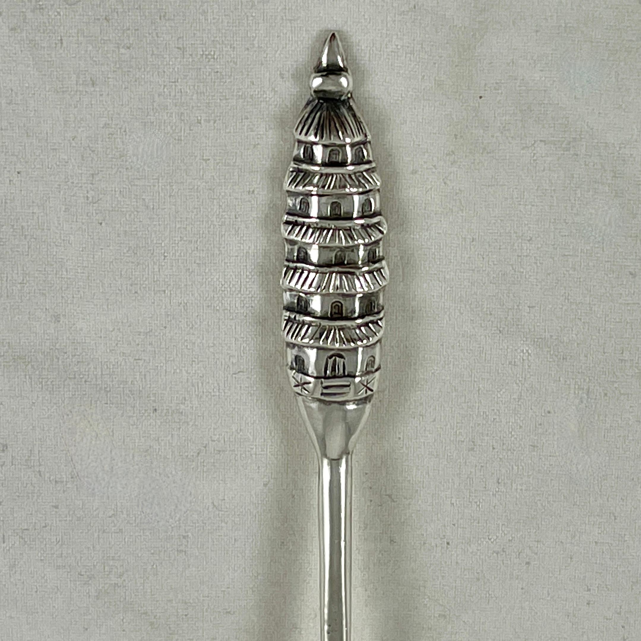 A sterling silver Asian Aesthetic souvenir spoon from Japan, circa 1930s.
950 silver, showing a multi-storied pagoda on the handle.

Stamped with Japanese characters.
5 in. L x 1 in. W x .75 in H
Excellent.