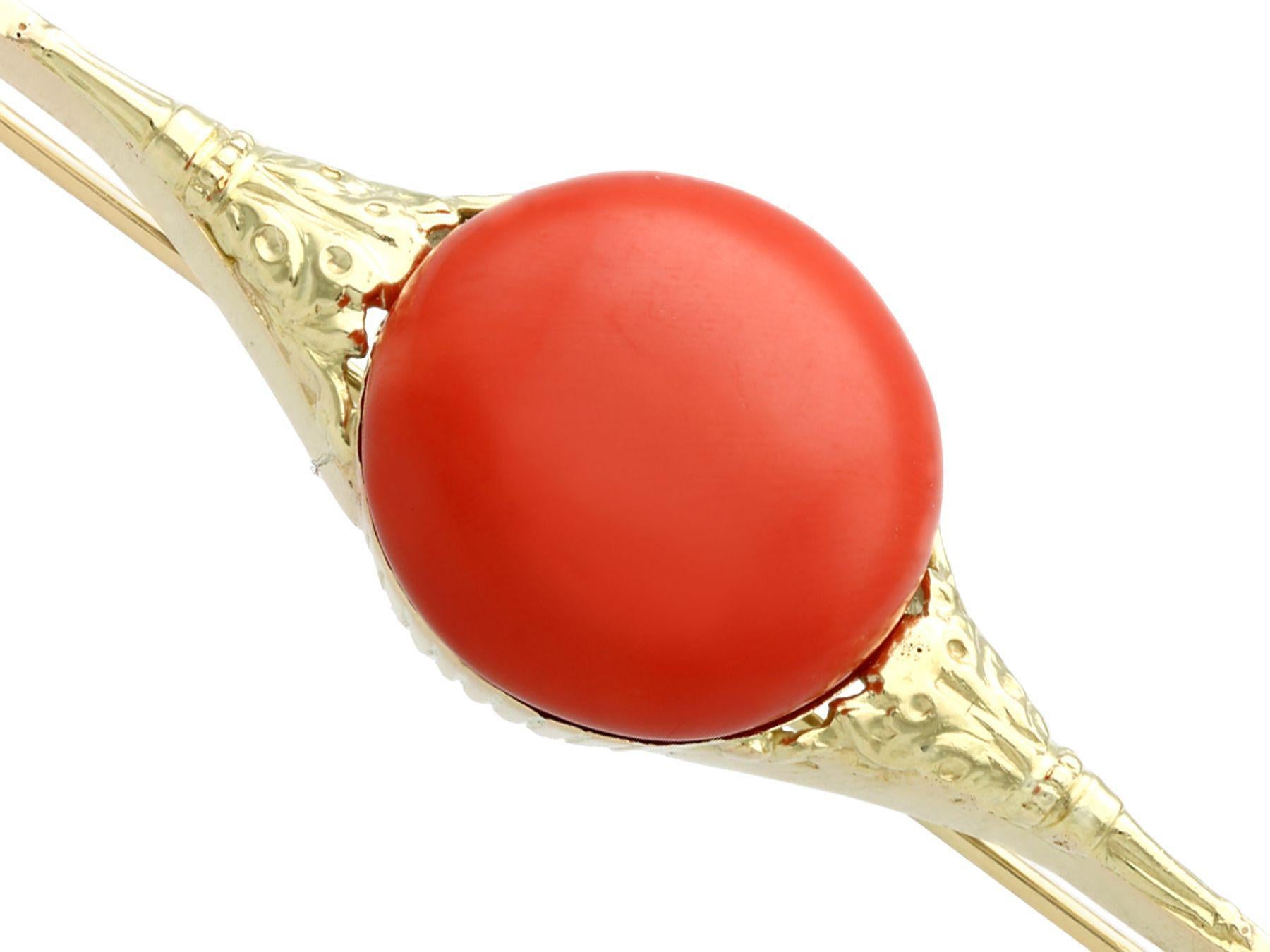 A fine and impressive antique 9.51 carat coral and 14 karat yellow gold bar brooch; part of our antique estate jewelry collections.

This impressive antique cabochon cut coral brooch has been crafted in 14k yellow.

The antique brooch features a