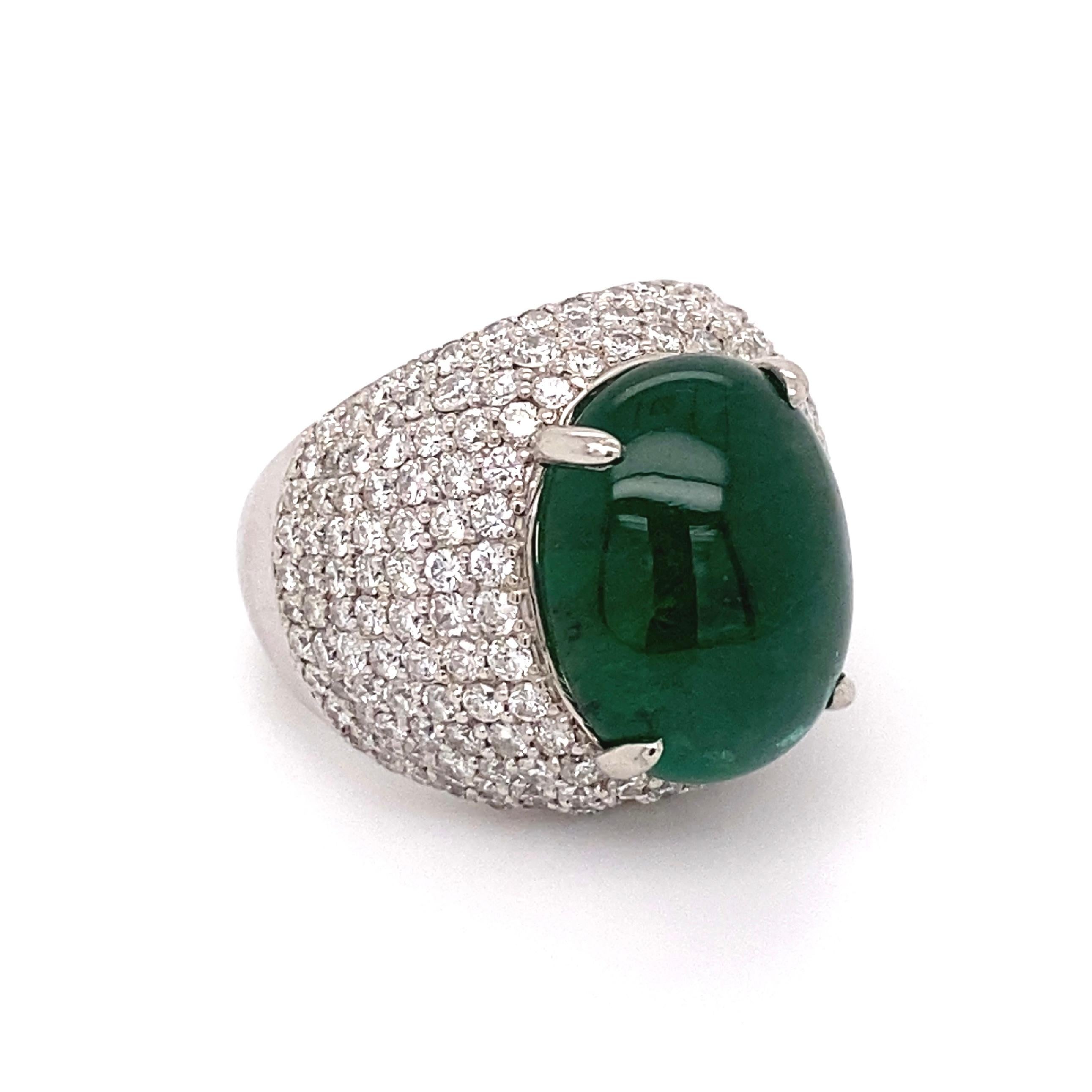 Simply Fabulous! Emerald and Diamond Dome Cocktail Ring, centering a securely nestled 9.51 Carat Cabochon Emerald, GIA certificate #2221156918 surrounded by Pave Hand set Diamonds, weighing approx. 2.65tcw. Hand crafted Platinum mounting. Approx.