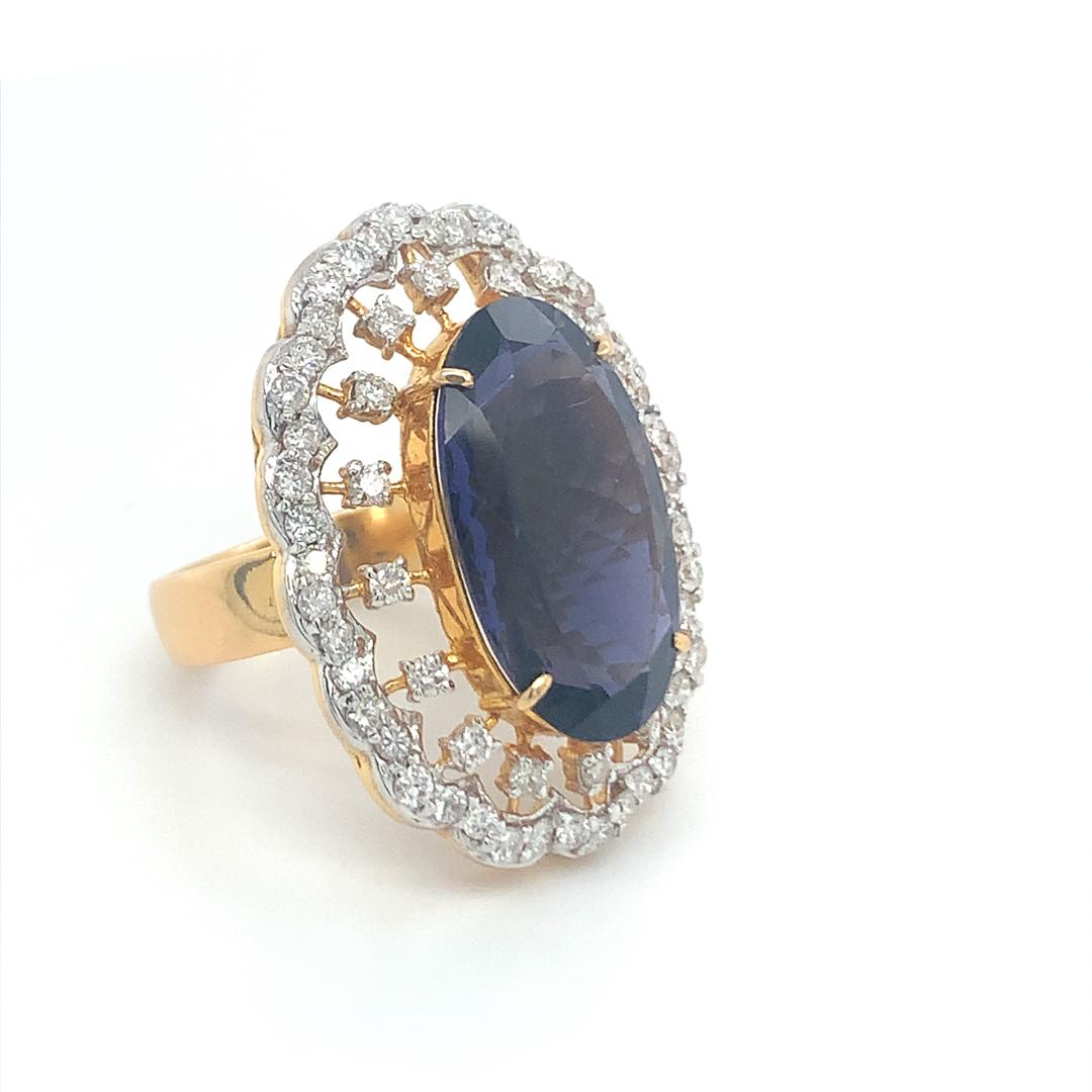 9.51 Carat natural Iolite with Diamond Halo set in 18 Kt yellow gold. 
