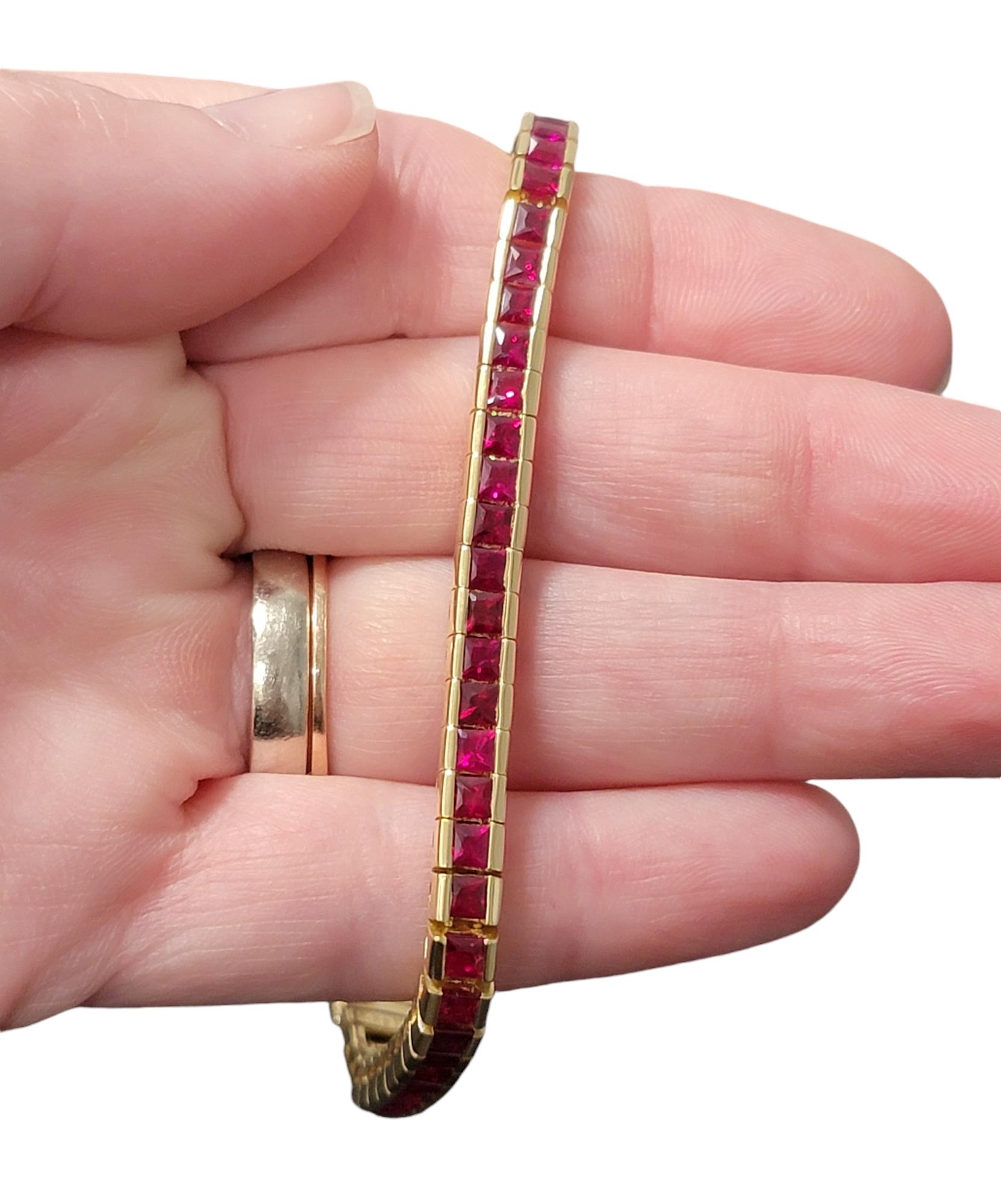 9.52 Carat Princess Cut Ruby Channel Set Tennis Bracelet in 18 Karat Yellow Gold For Sale 1