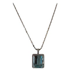 9.55 Carat Emerald Cut Light Blue Aquamarine and Diamond Halo Pendant Necklace
