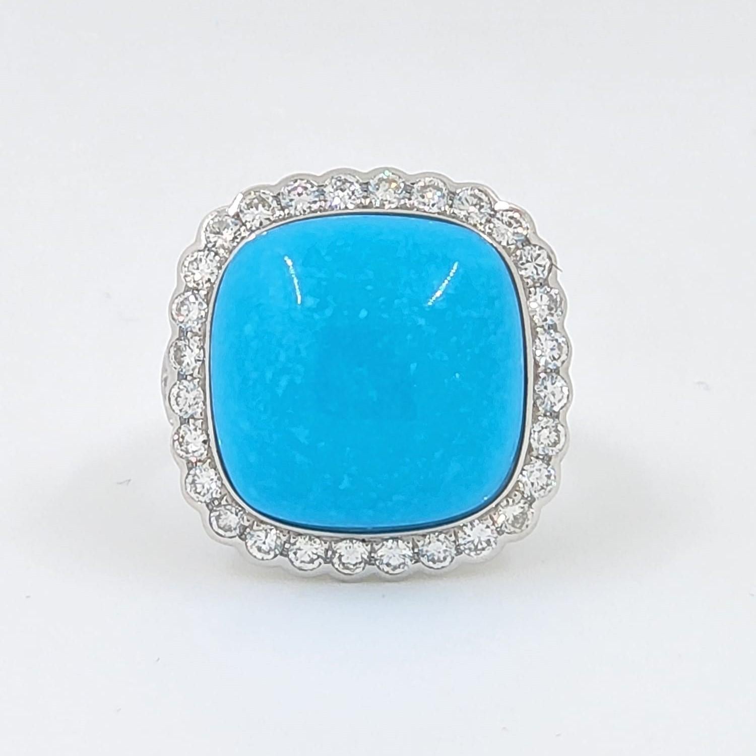 This ring features a 9.55 carat cushion sleeping beauty turquoise. All turquoise use in production are from the prominent Sleeping Beauty Mine. Famous for it solid, light blue color with no matrix. Assented with 1.02 carat of white round diamonds.