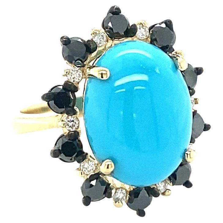 A unique stunner.....9.56 Carat Turquoise Black and White Diamond Yellow Gold Cocktail Ring

This ring has a 7.93 Carat Oval Cut Turquoise and is surrounded by 10 Round Cut Diamonds that weigh 0.19 Carats (Clarity: SI2, Color: F) and 10 Black