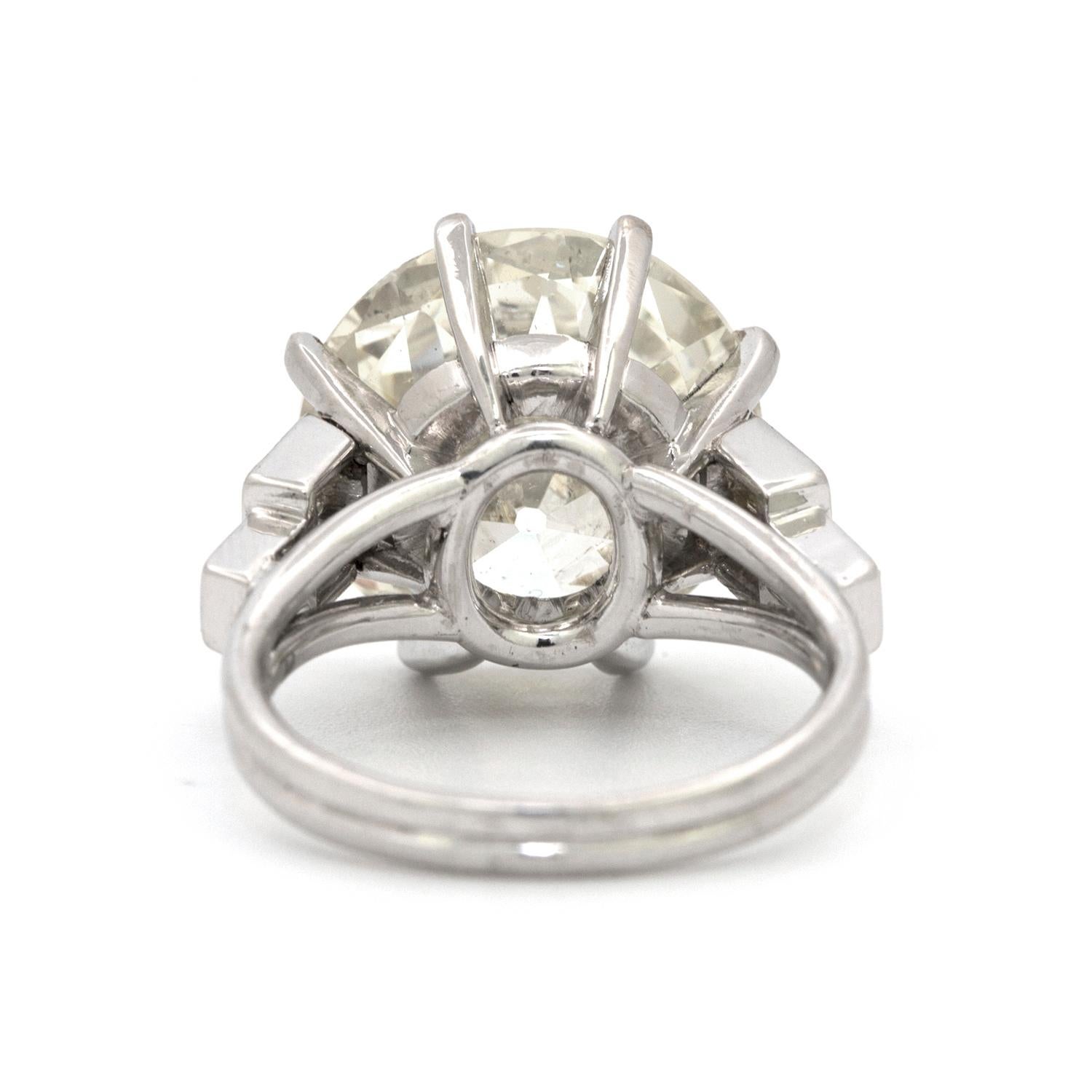 A custom made 8 prong platinum ring featuring a 9.58 carat Old European Cut diamond that is beautifully accented with 6 straight baguette shaped diamonds that weigh 0.60 carats.       

Size 5 3/4  