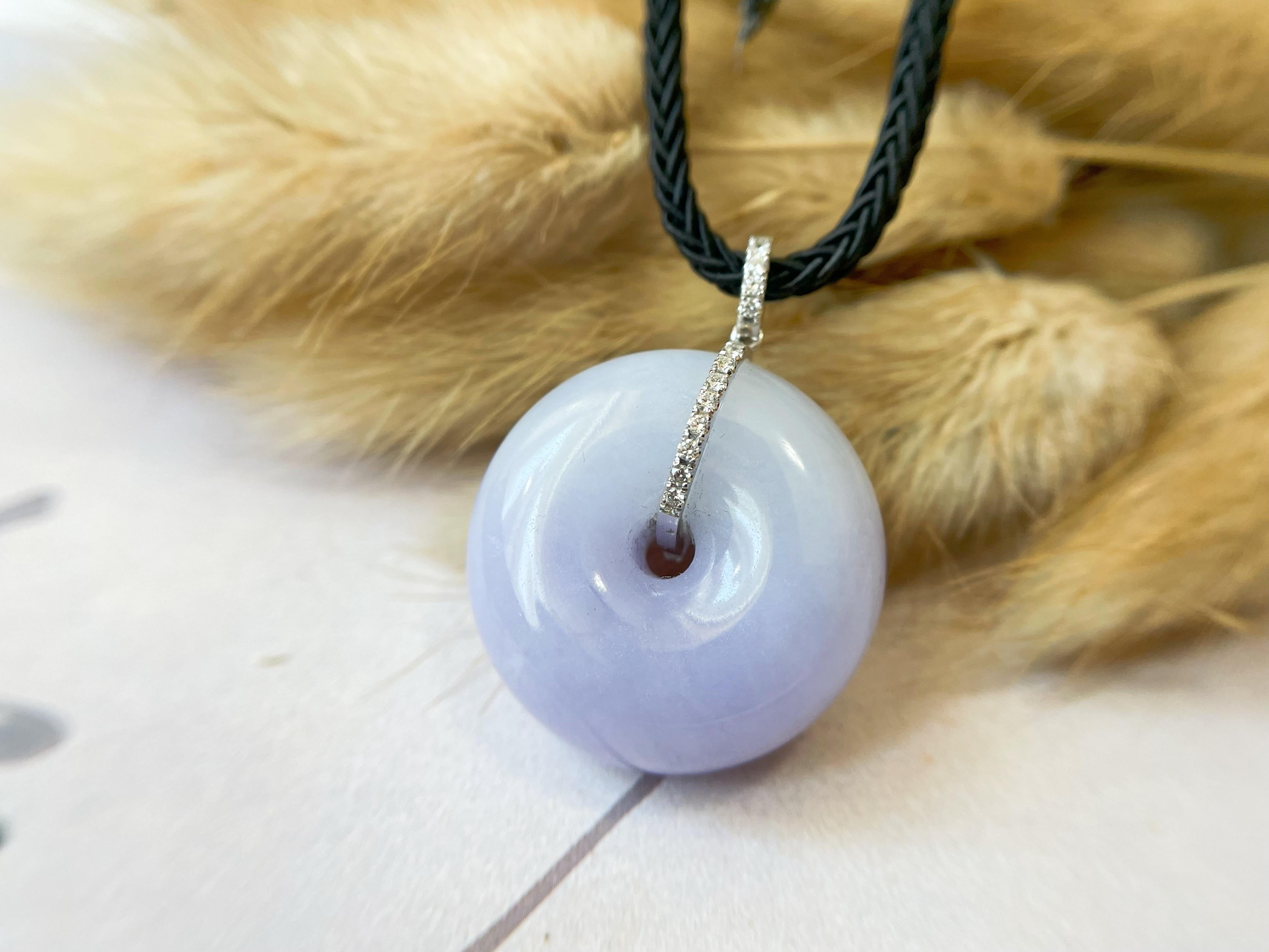 Indulge in the beauty and power of jadeite jade with this exquisite lavender donut jadeite pendant. Made from 100% natural, untreated, and undyed Type-A Myanmar jadeite jade, this pendant features a stunning round shape with a beautiful lavender