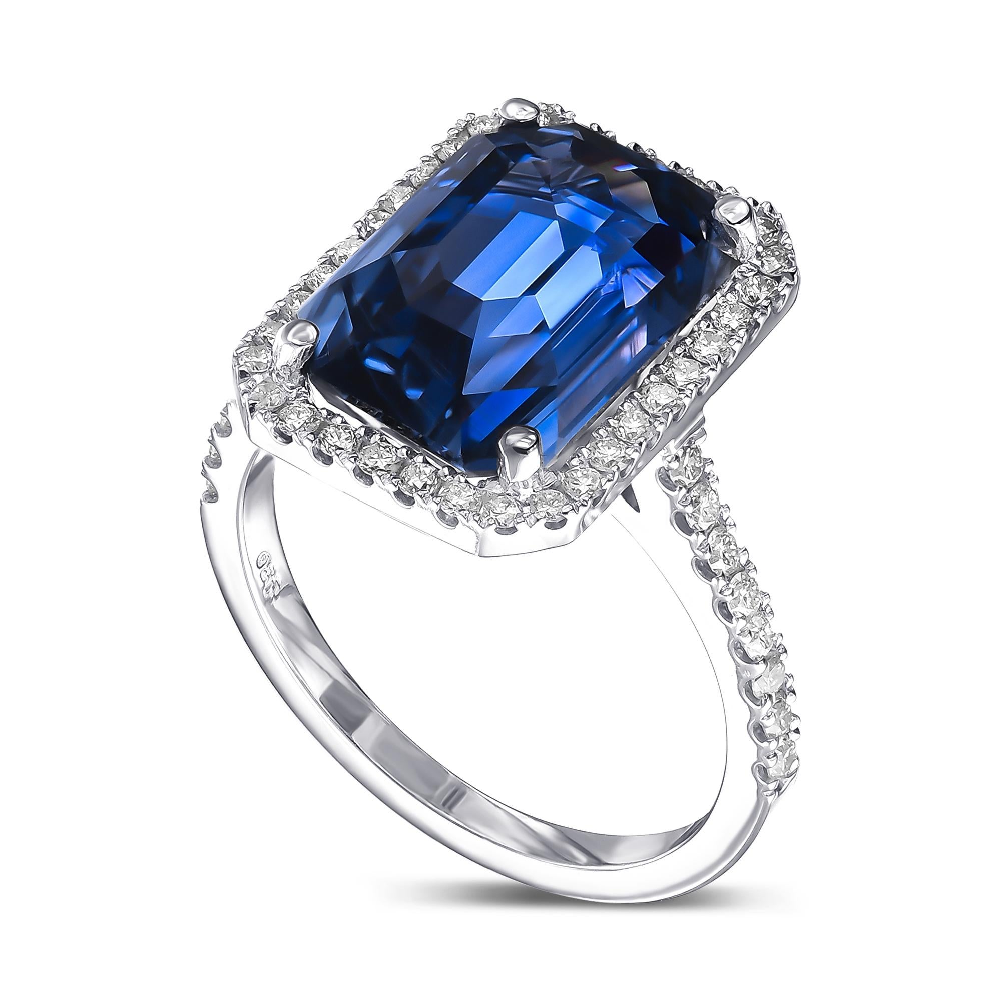 Ring can be sized free of charge prior to shipping out.    

Center Natural Sapphire
Weight: 9.59 ct
Color: Blue
Shape: Cut Cornered Rectangle Step Cut

Side Stones:
Round 52 pieces / 0.60 cttw I-K VS2-SI2 Natural Diamonds

Item ships from Israeli