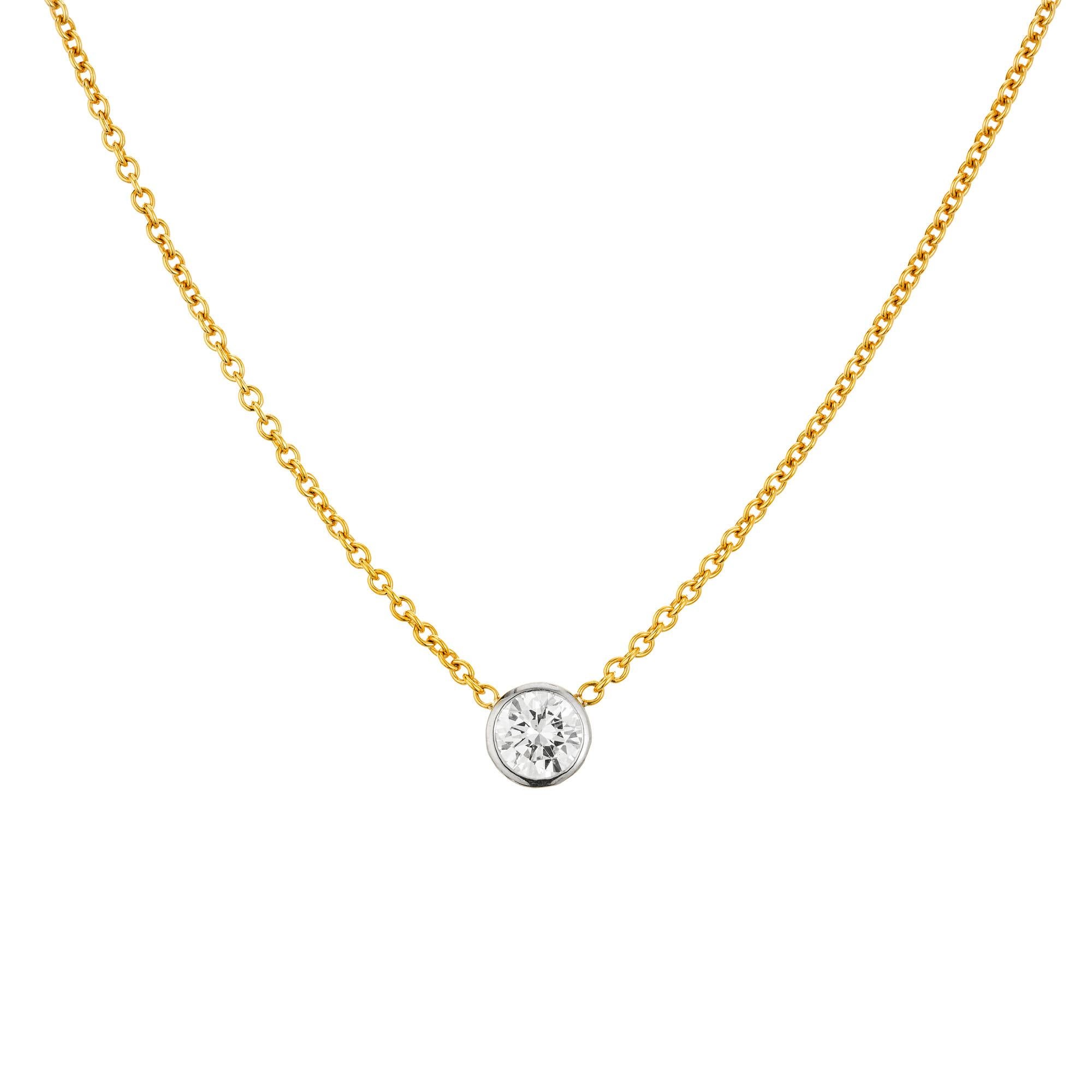 Classic diamond pendant necklace. The center piece of this necklace is the .95ct 18k white gold bezel set round brilliant cut diamond, which is accented with a 16.5 inch cable link 18k yellow gold chain. The EGL has certified this as G-H near