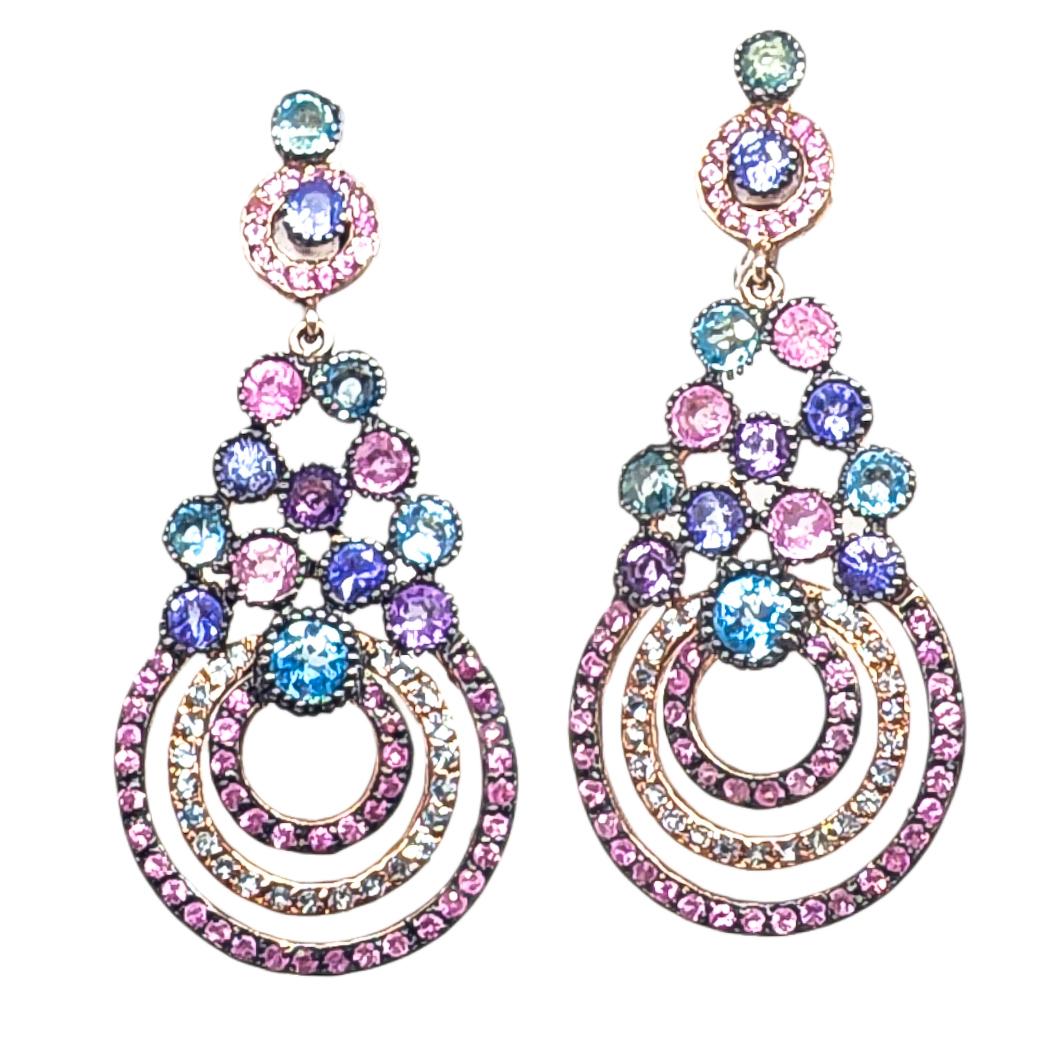 One pair of post and omega back Drop Earrings featuring a Deliciously Sweet Confectionery of Colored Gemstones in Pinks, Blues and Purples. These festive Ombre Earrings are an ode to beautiful Spring Flowers and are an appropriate accent for all