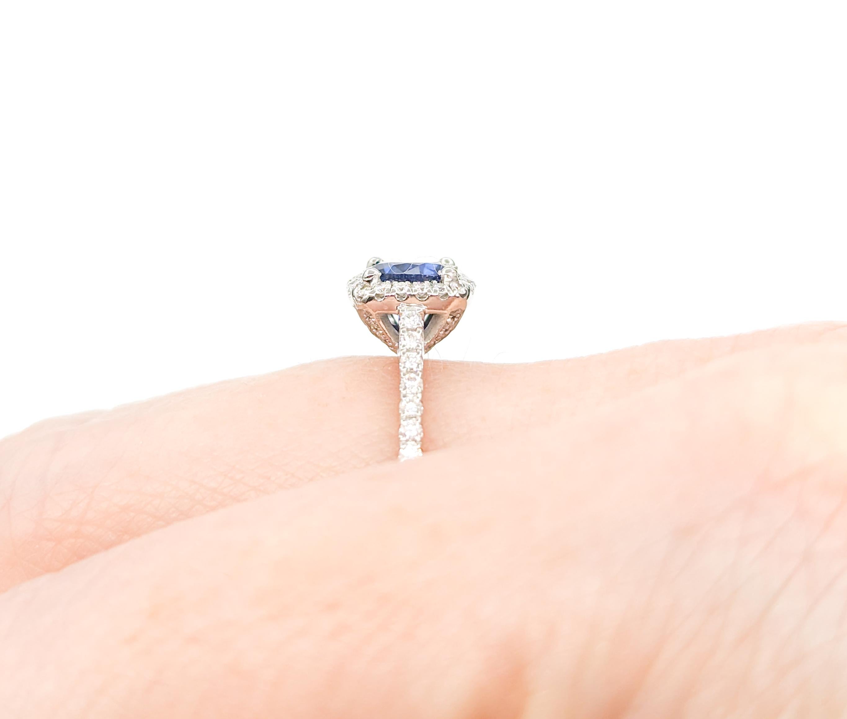 Contemporary .95ct Sapphire & Diamond Halo Ring in White Gold For Sale